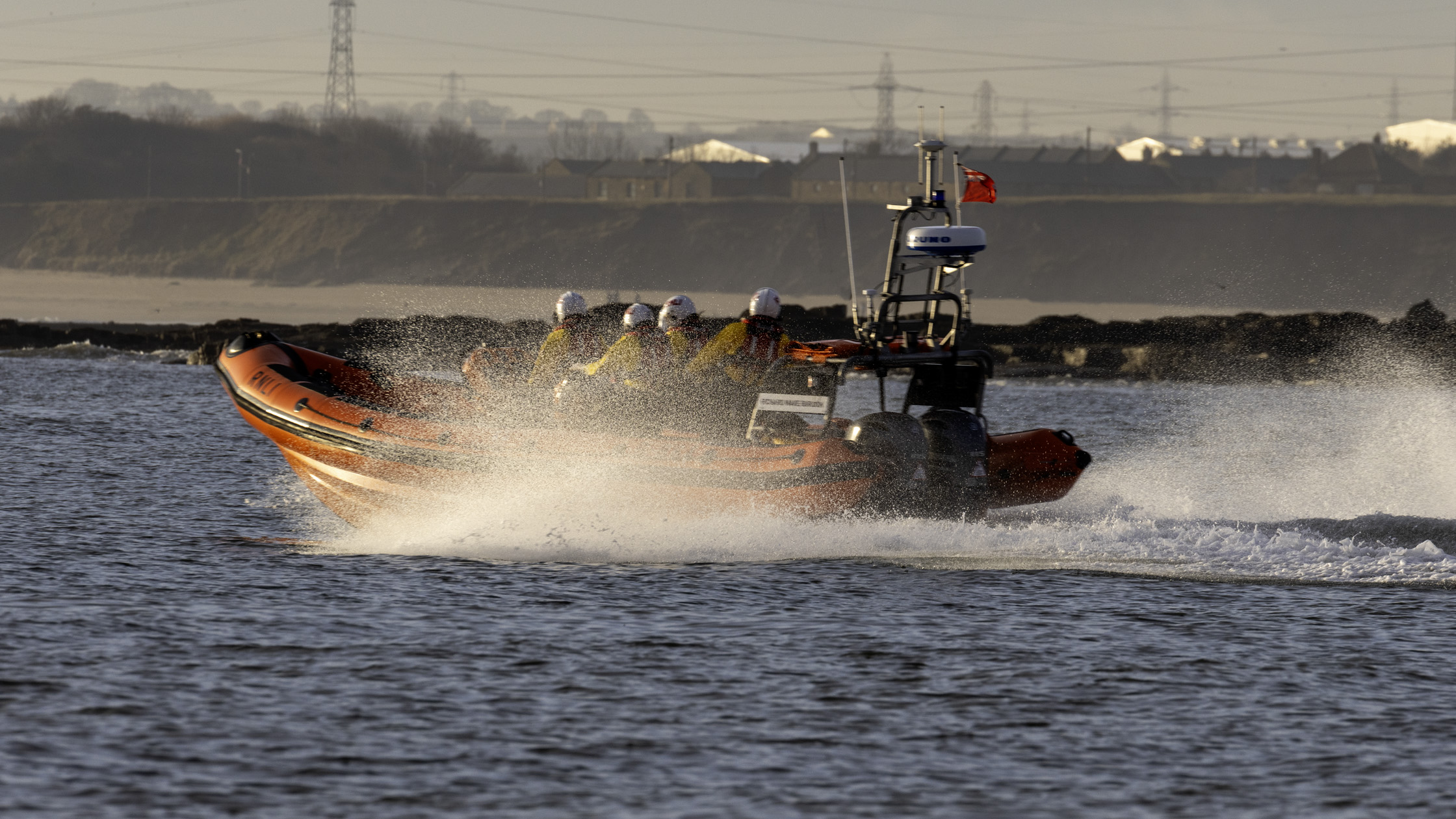 Lifeboat heading at full speed out to Cambois Bay