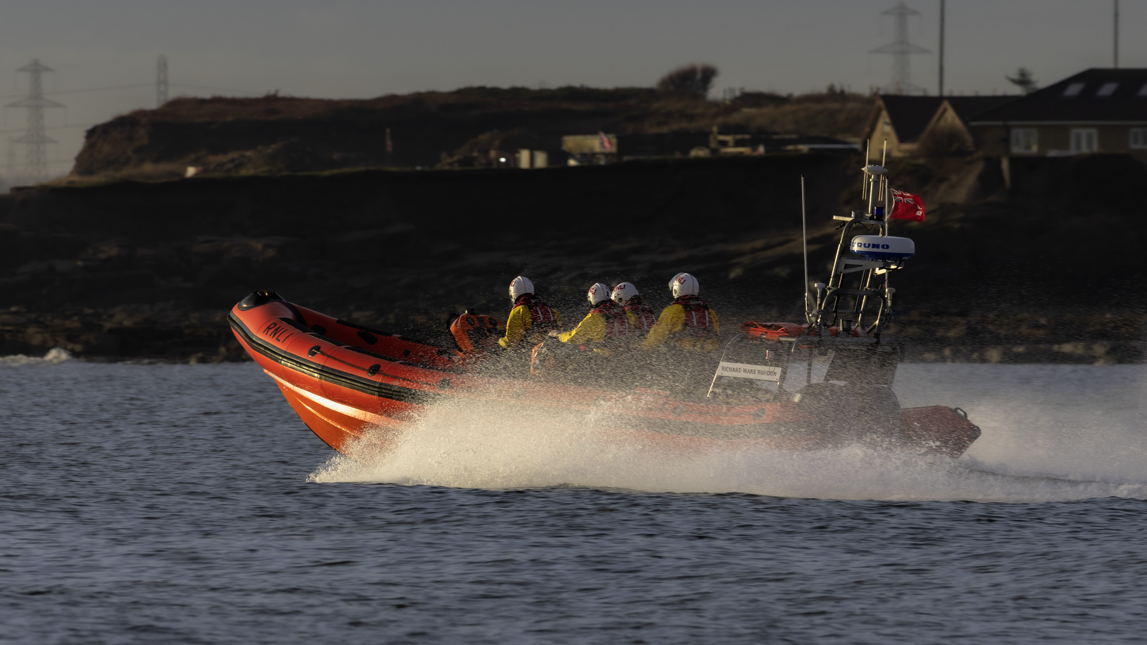 Lifeboat heading at full speed out to Cambois Bay