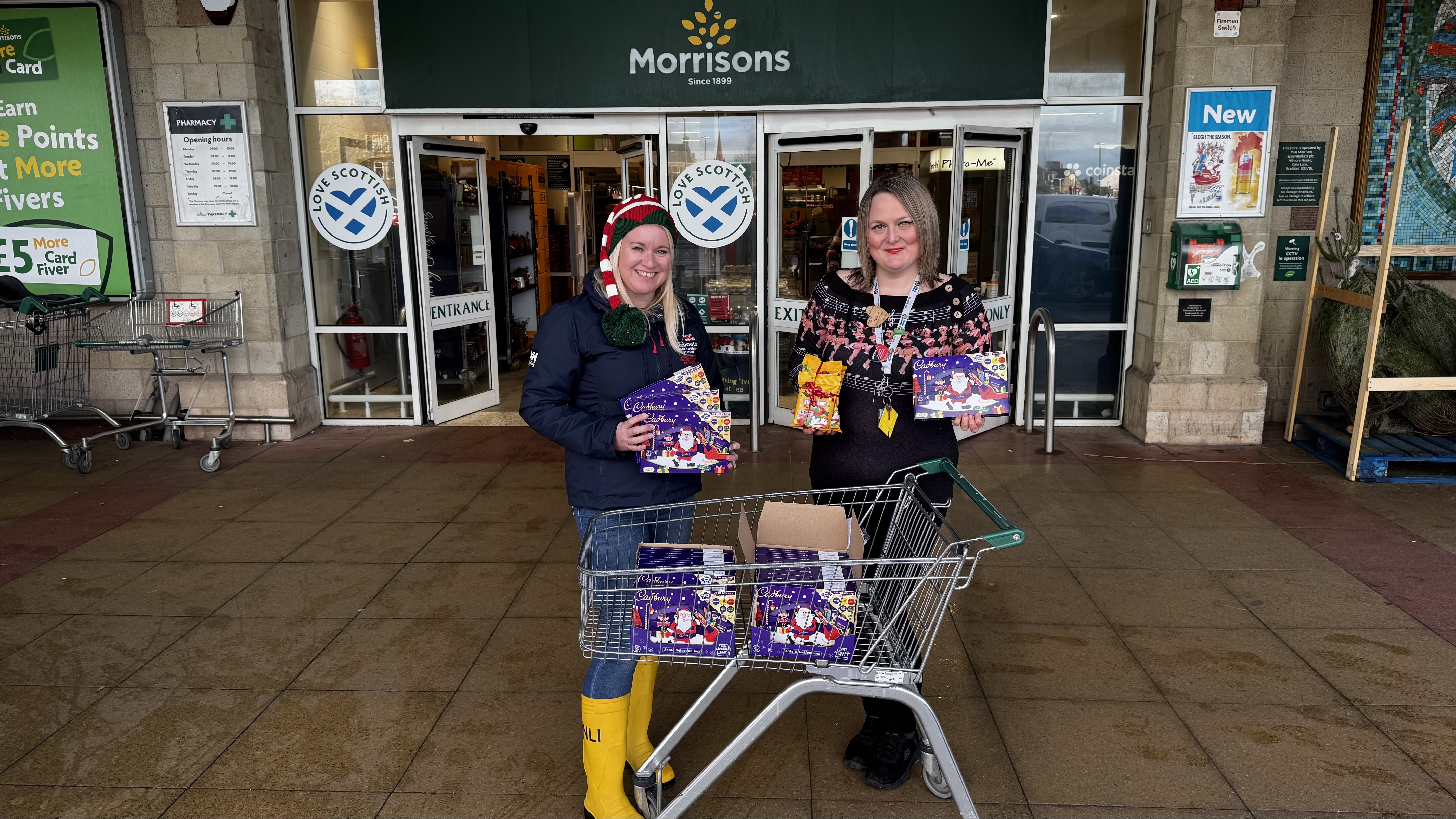 Pictured is Claire from Largs RNLI collecting selections boxes and dog treats from Lorraine at Largs Morrisons
