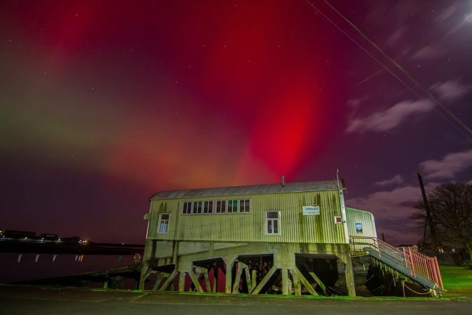 Berwick-upon-Tweed lifeboat station with Northern lights in the background
