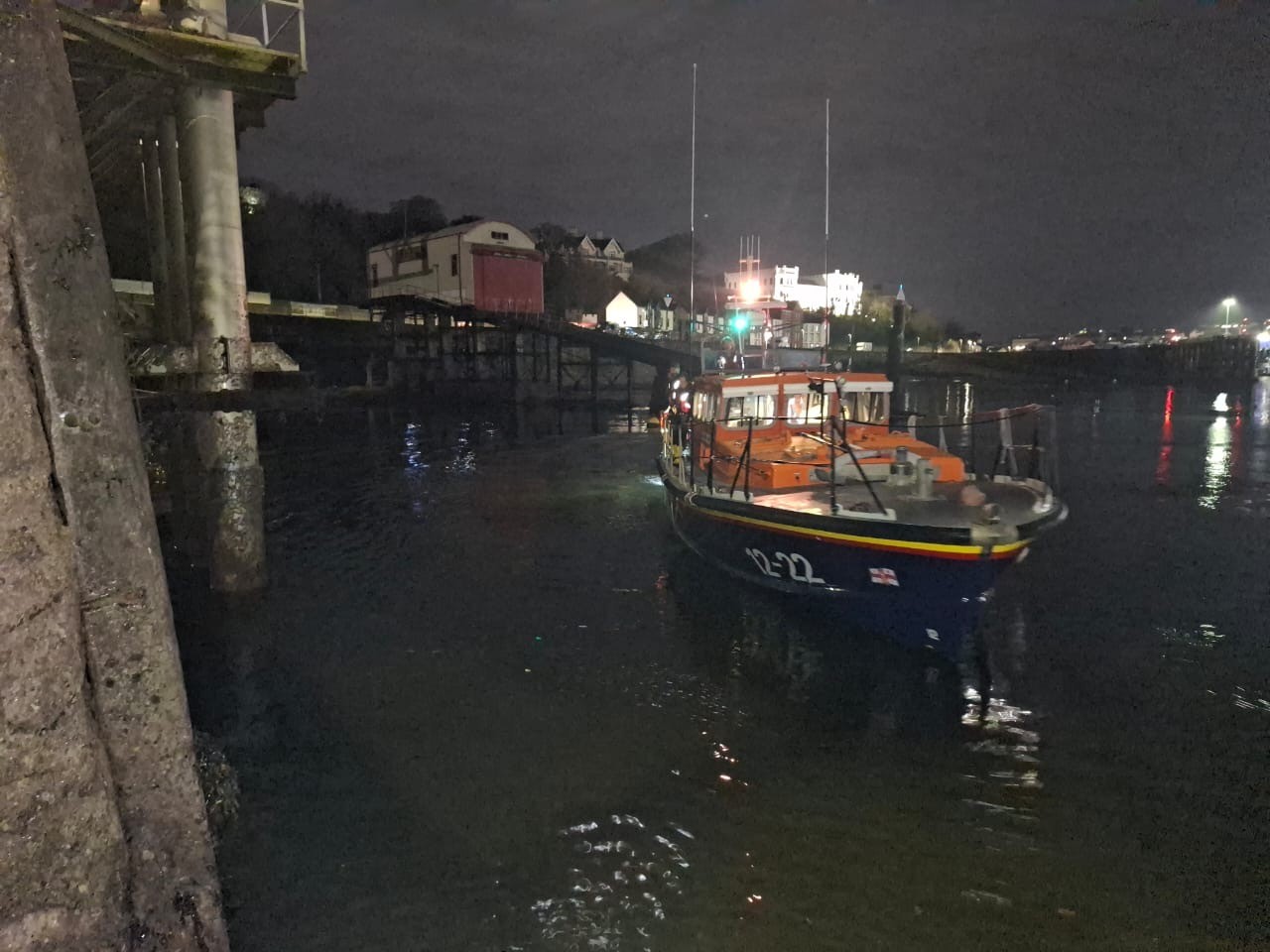 Ruby Clery lifeboat in Douglas Harbour in dark early morning.