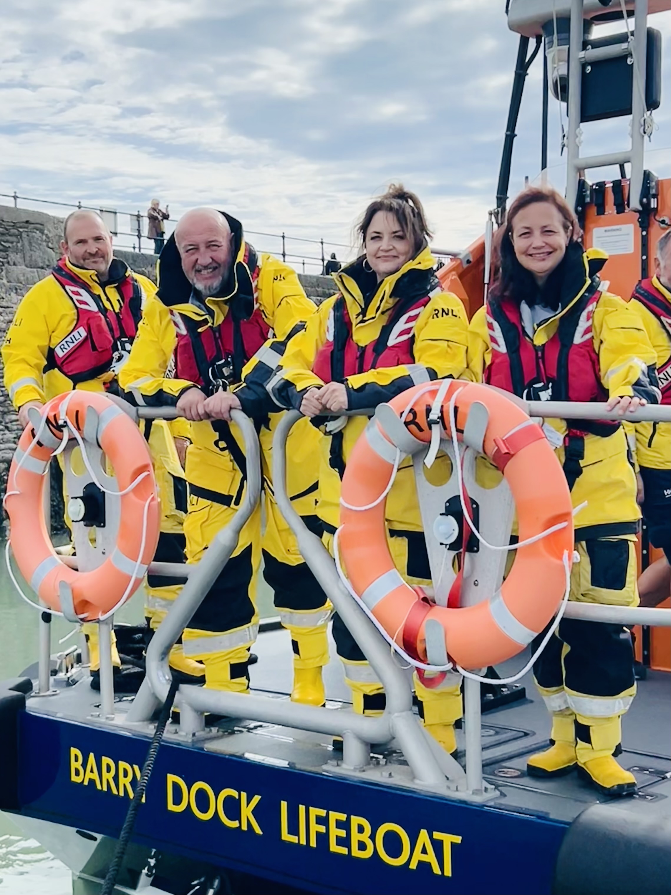 The photo shows Ruth, Steve and Maria with Barry Dock's coxswain Hugh 'Spud' Davies aboard Barry Dock's Shannon lifeboat