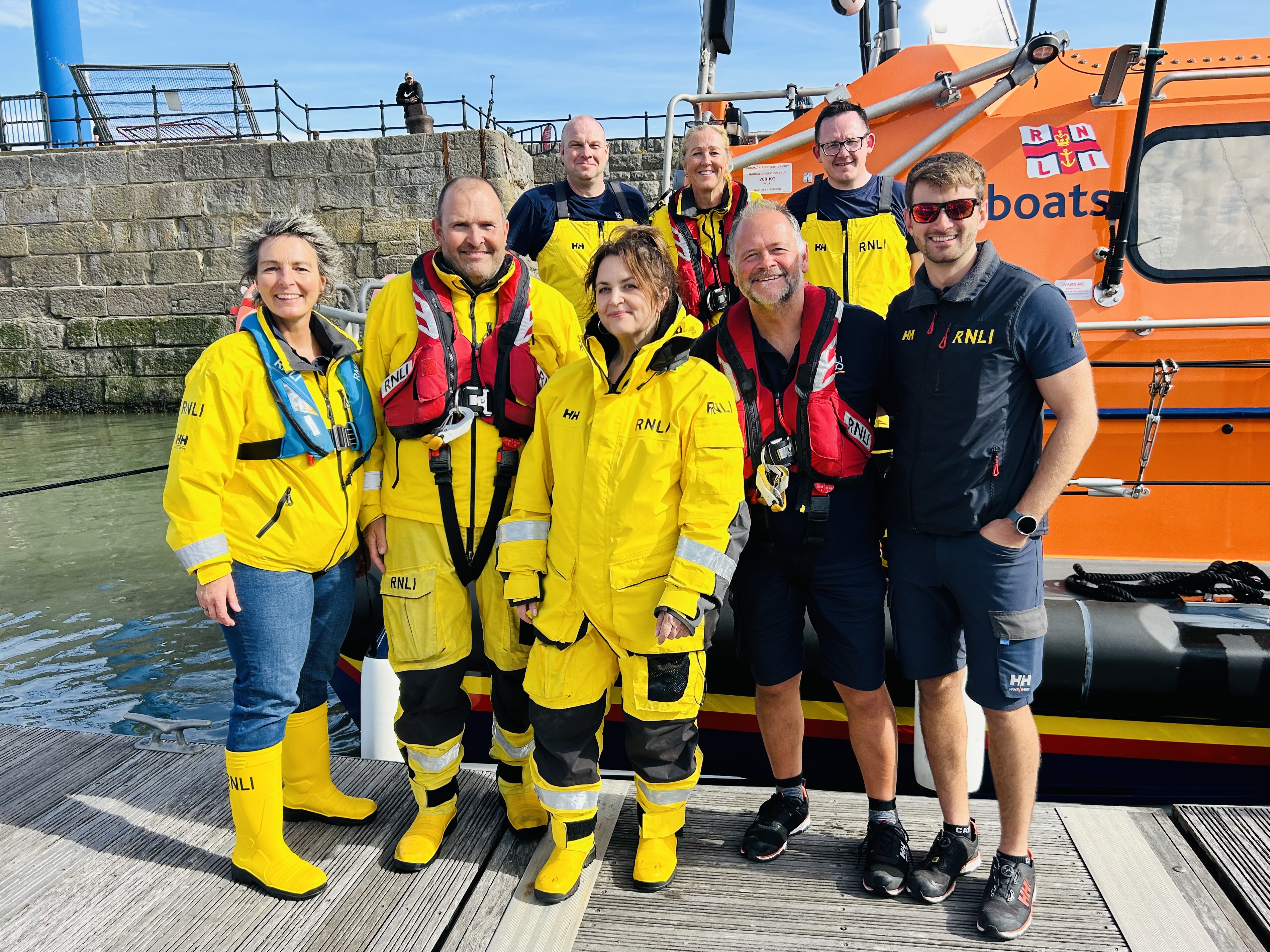 The photo shows Ruth and the Barry Dock crew standing on the pontoon next to the lifeboat