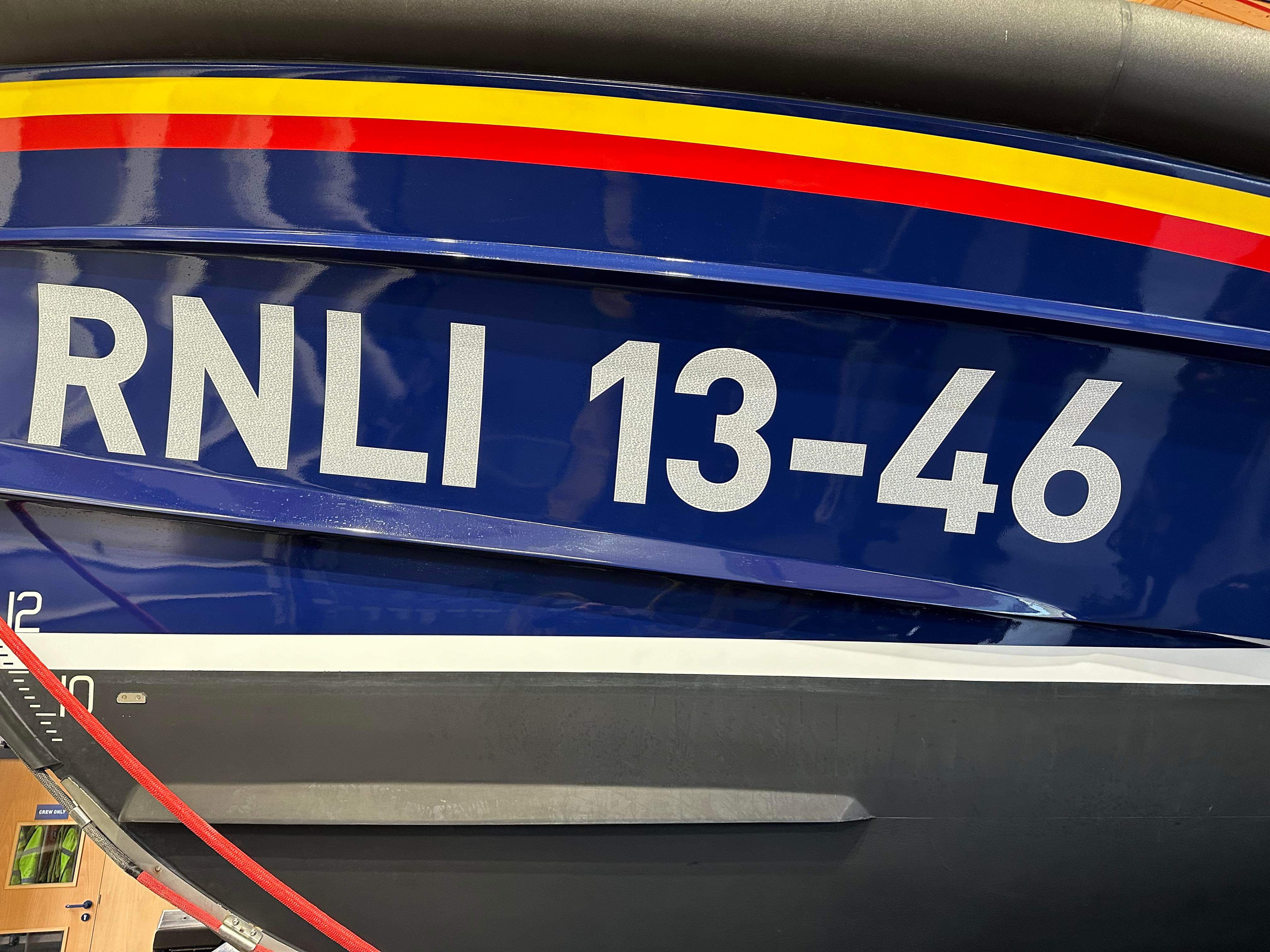 13-46 decals on Shannon class lifeboat white number decals on blue background of the lifeboat
