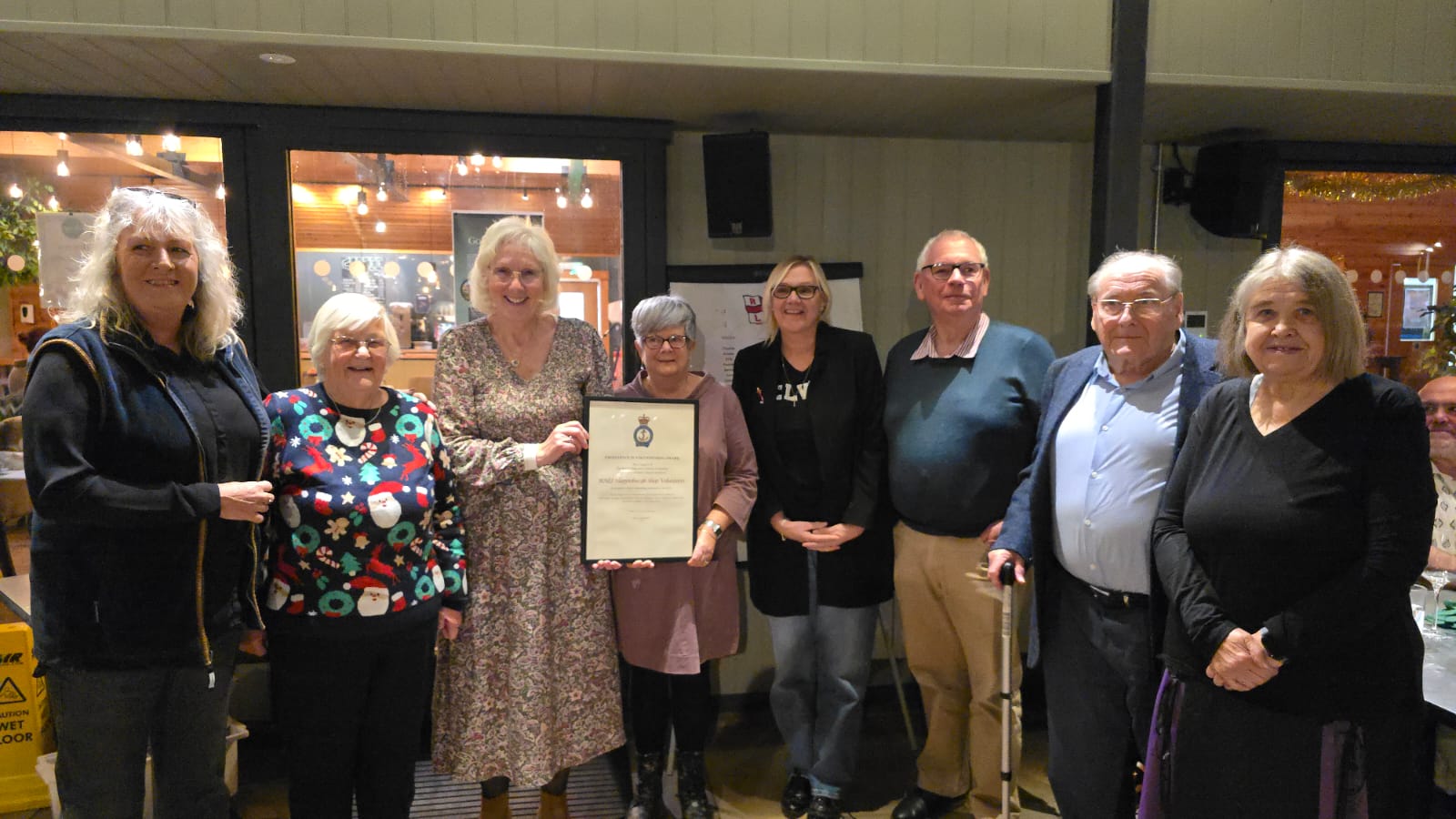 Shop volunteers receiving their Volunteer Excellence Award