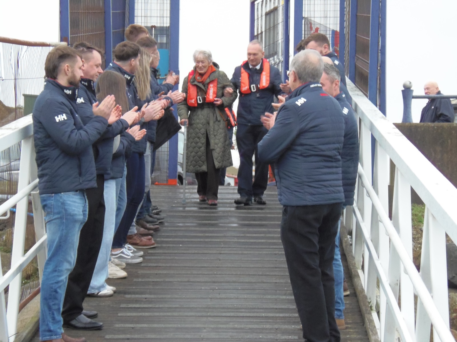 Miss Margaret Cameron pictured making her way to see the new Shannon alongside John Fisher, Kilkeel RNLI Lifeboat Operations Manager