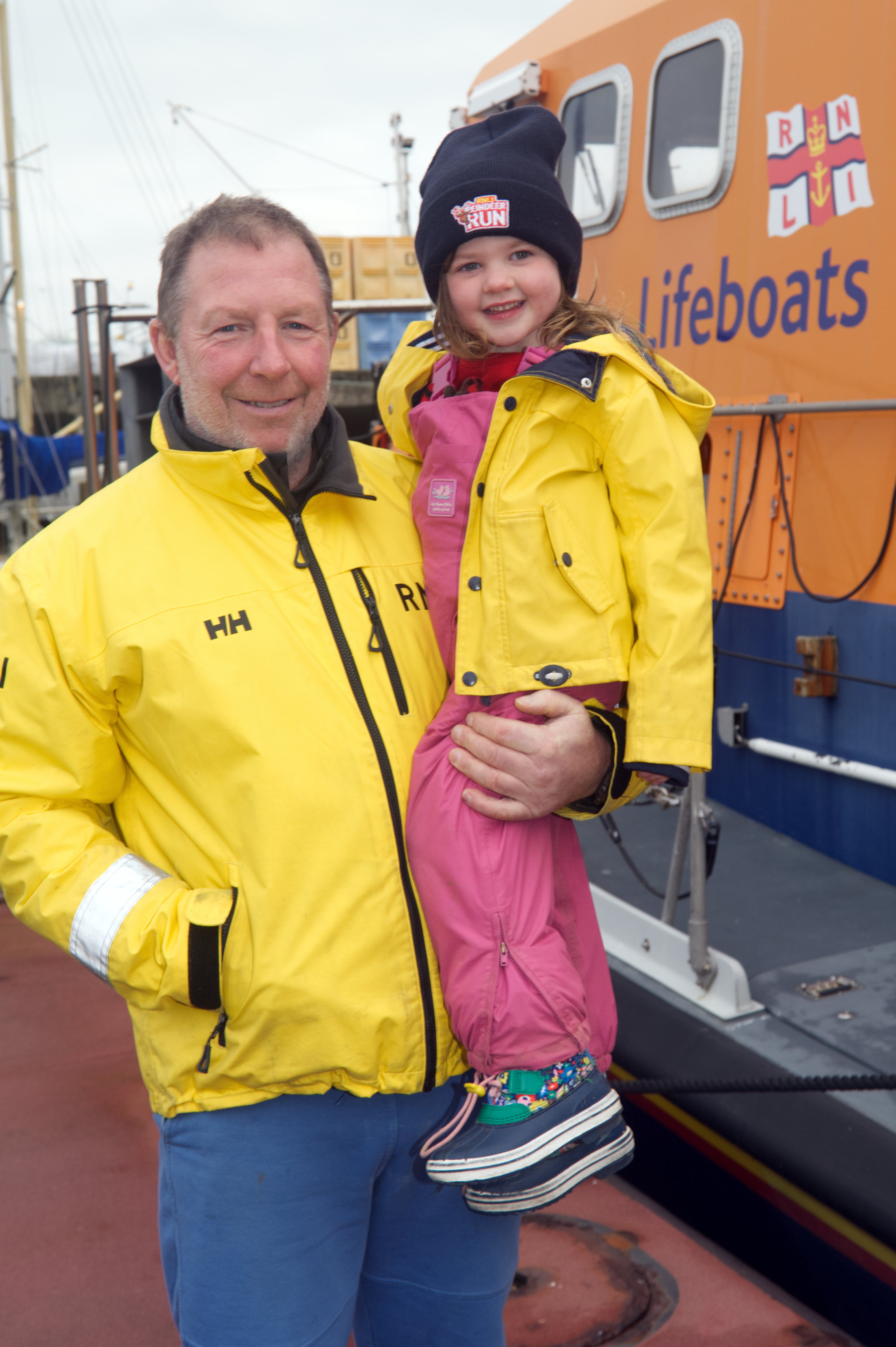 Picture shows a little girl Alice Bigham with coxswain Patch Harvey