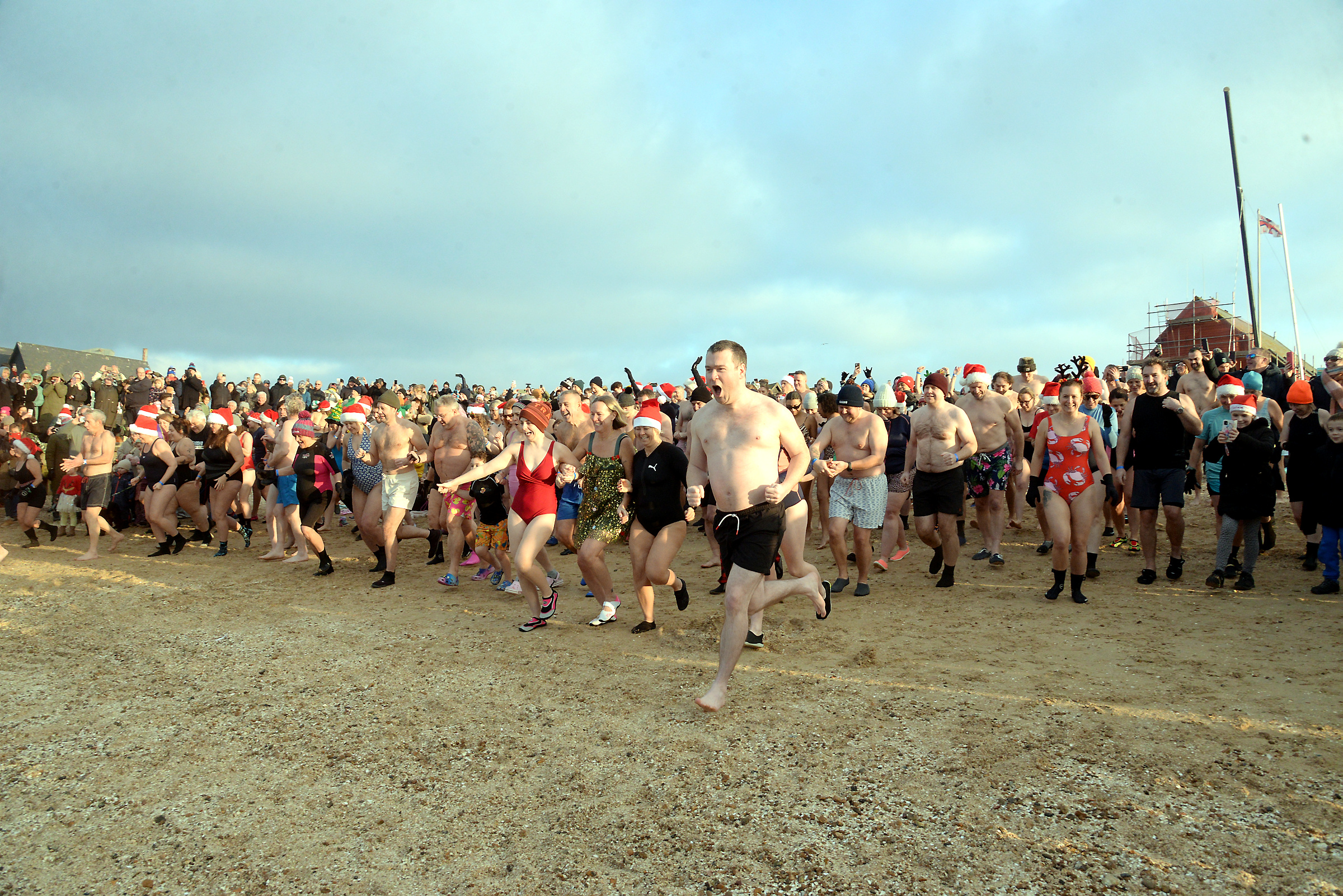 The charge down the beach for the Boxing Day Sponsored Dip at Whitstable RNLI.