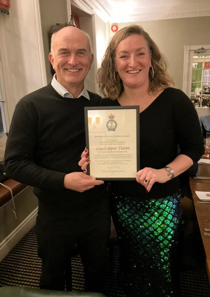 Southwold Lifeboat Operations manager Simon Hazelgrove, presenting Lisa Cooper Dann with the 'Achievement in Volunteering Award'