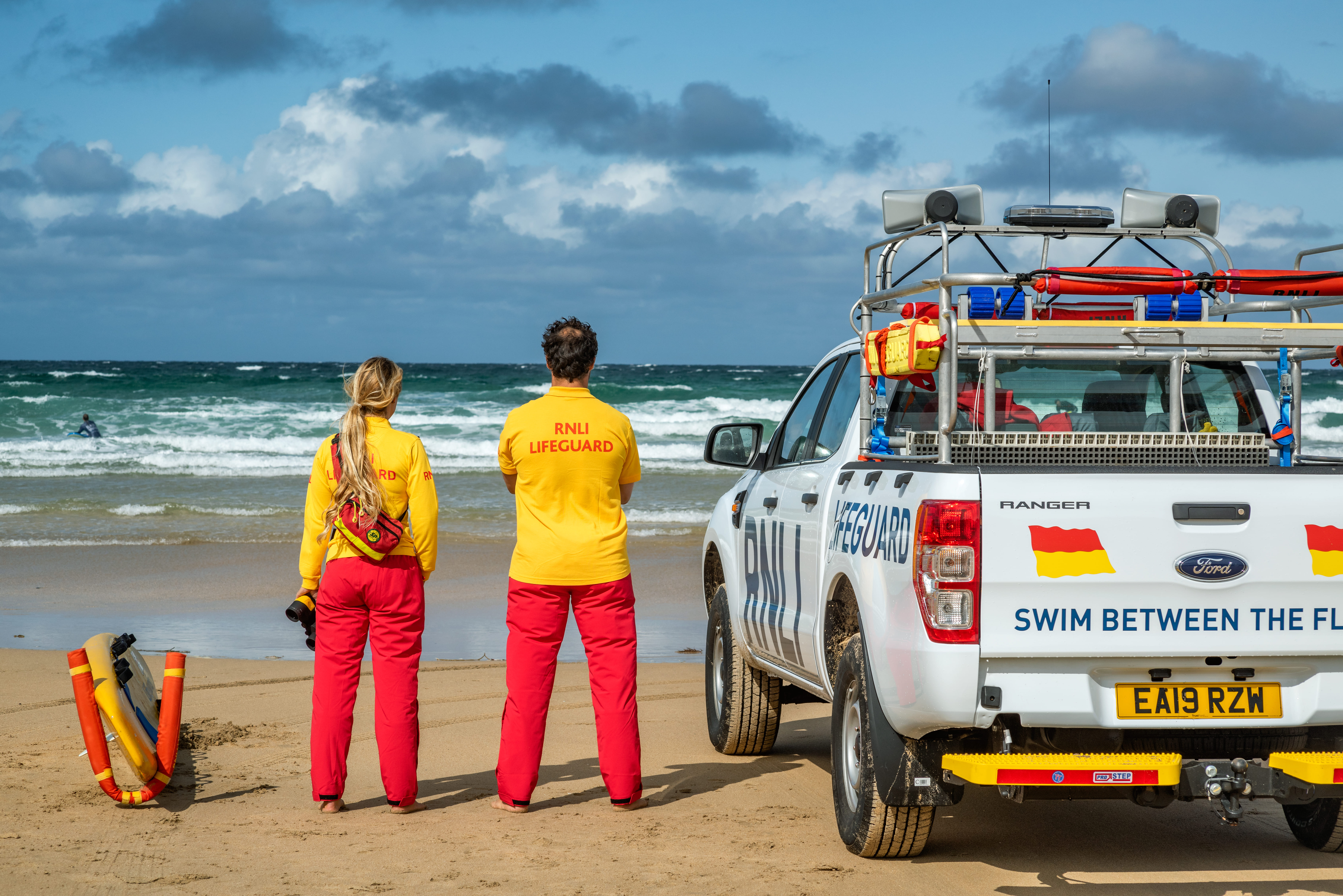 Two lifeguards keep watch over the beach