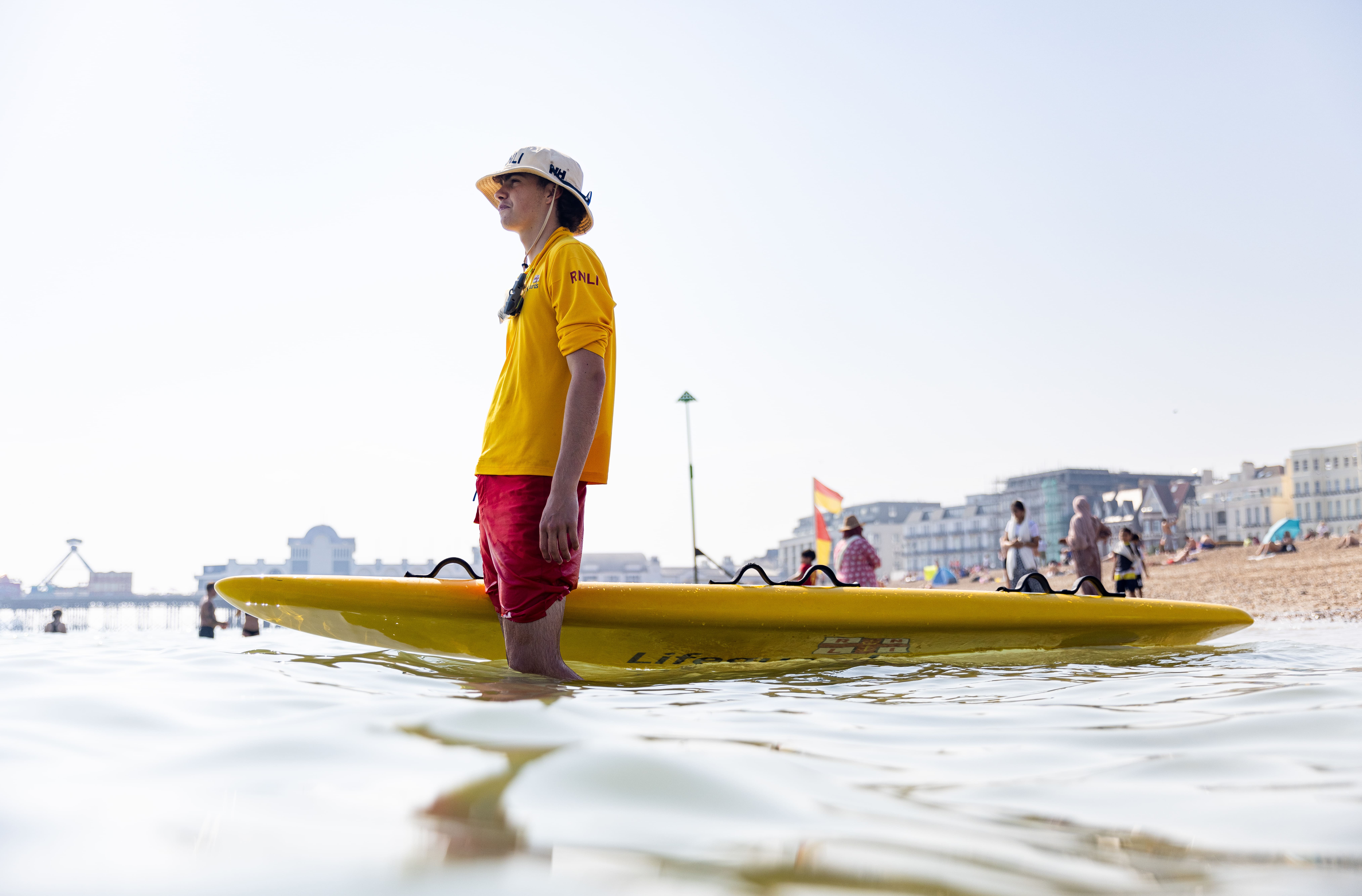 A lifeguard standing in the water