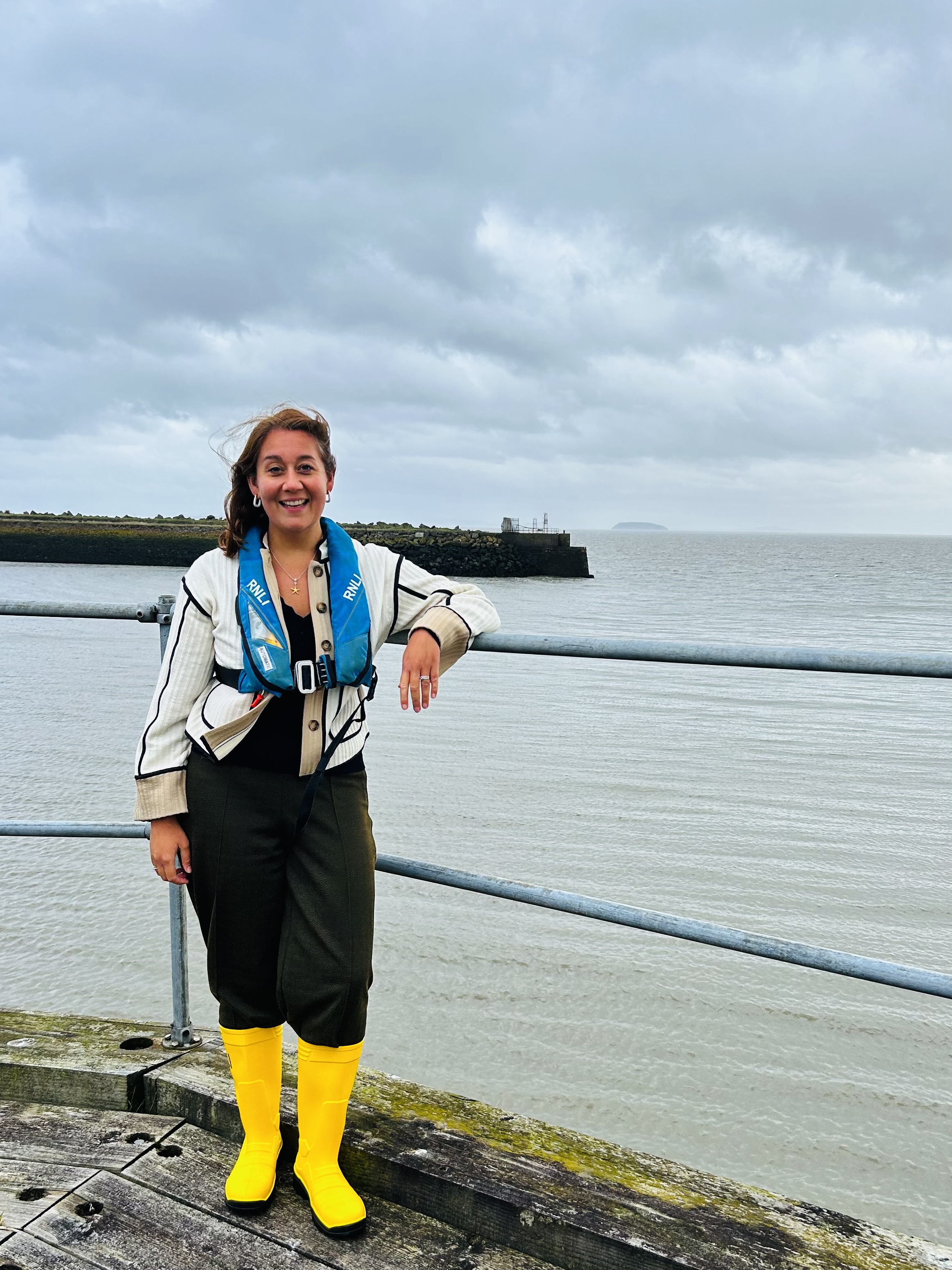 The photo is of Olivia with the breakwater at Barry Dock in the Background
