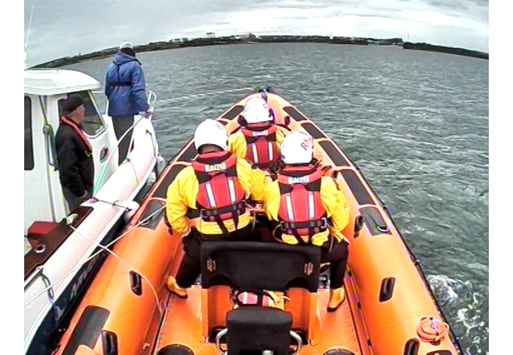 The lifeboat assisting the boat and its crew