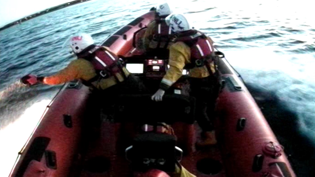 Searching for two persons in the water as darkness falls