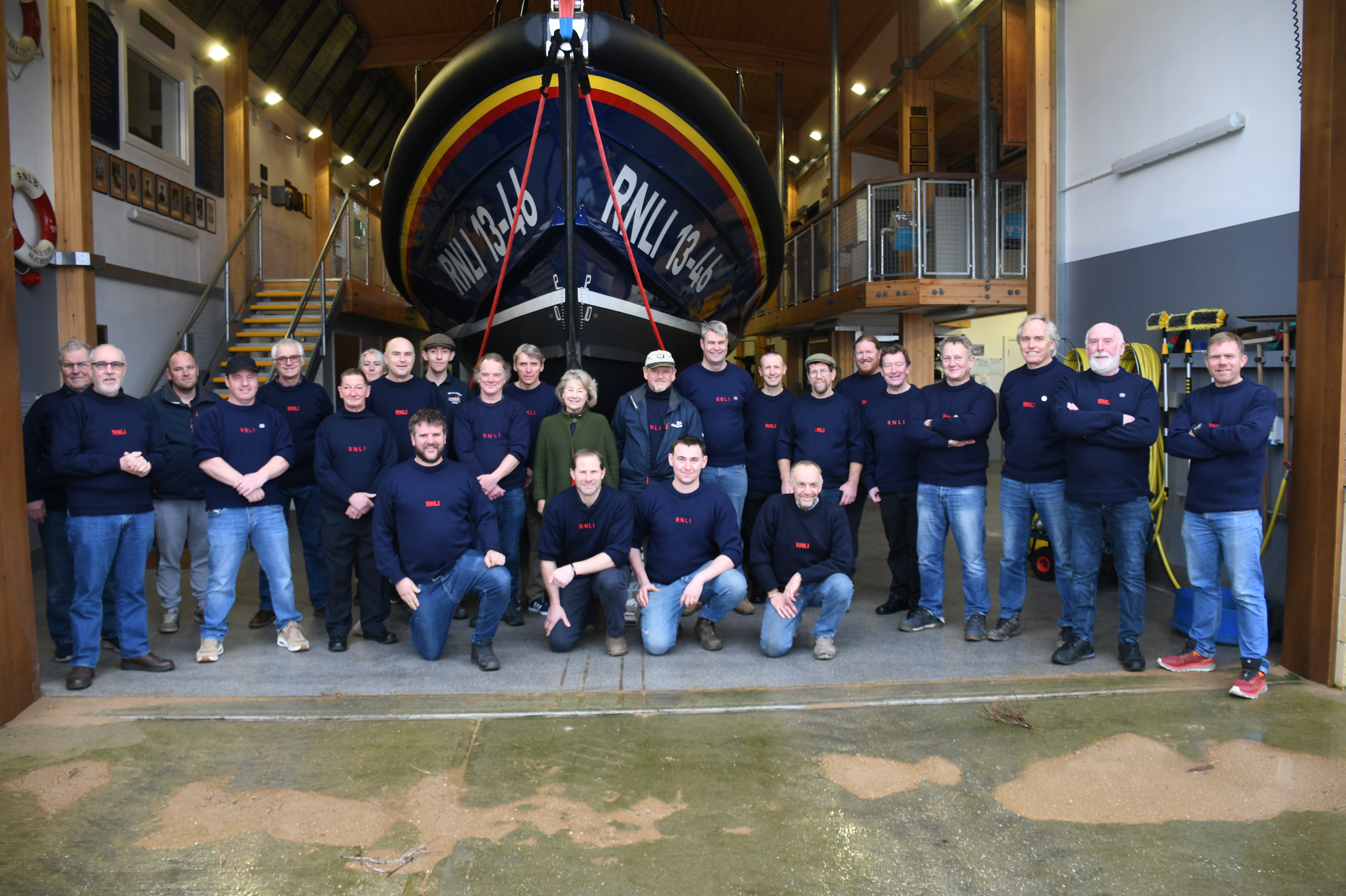 Sarah Countess of Leicester with Wells RNLI crew member at Kings coronation medal presentation ceremony In front of Shannon class lifeboat ‘Duke of Edinburgh’