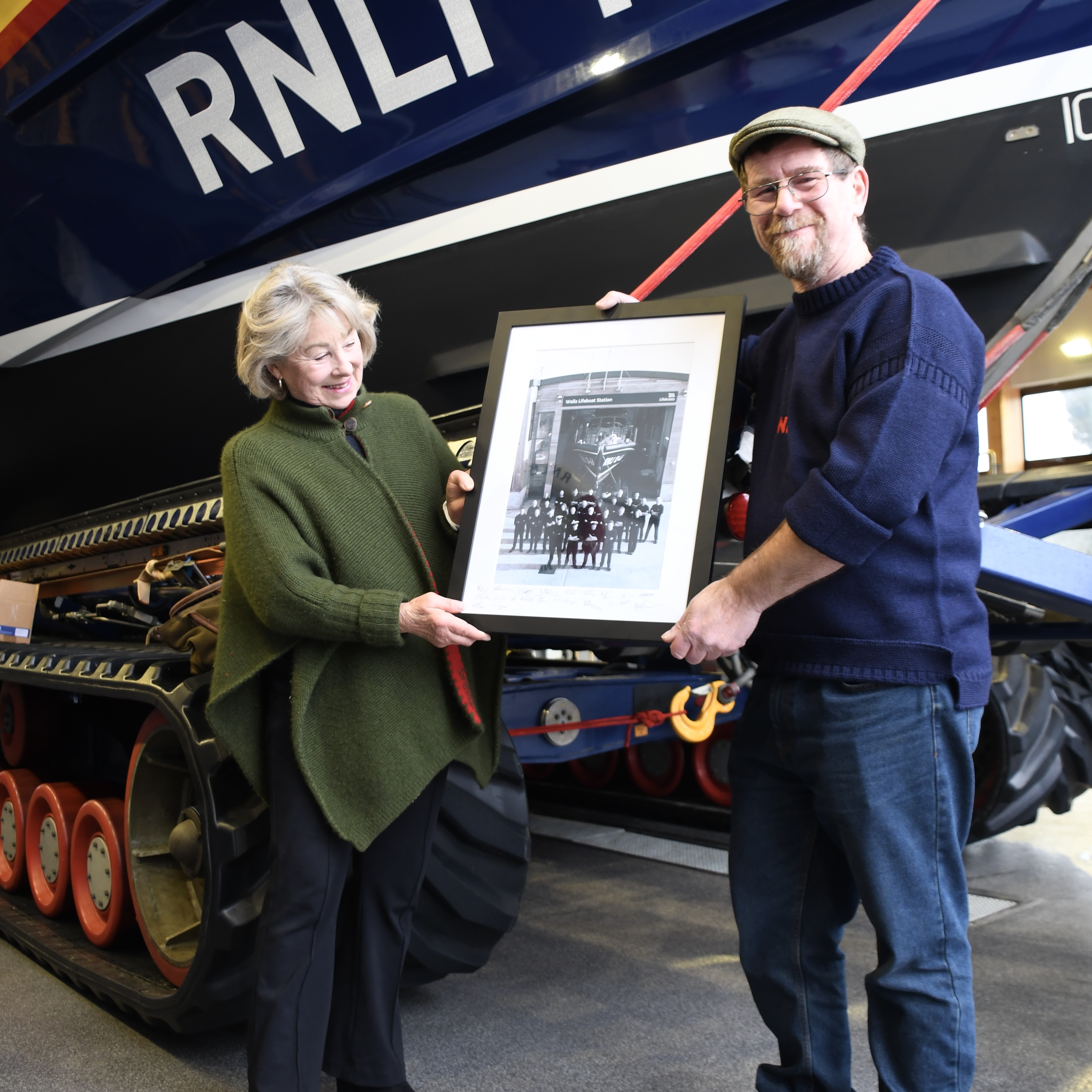 Sarah Countess of Leicester presented with photograph of Wells RNLI by Coxswain Nicky King In front of Wells RNLIs Shannon class lifeboat Duke of Edinburgh
