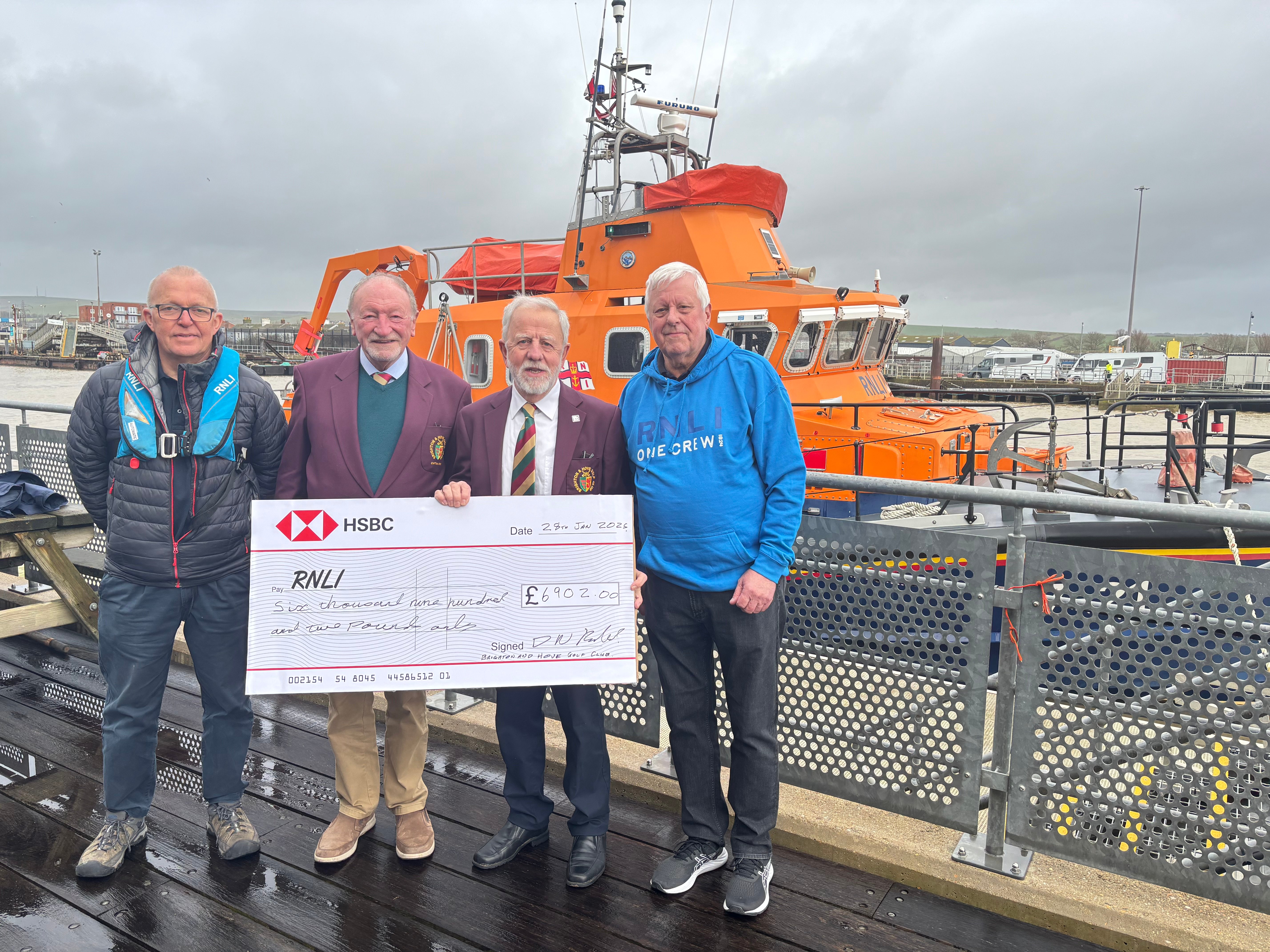 The group standing on the decking of Newhaven RNLI
