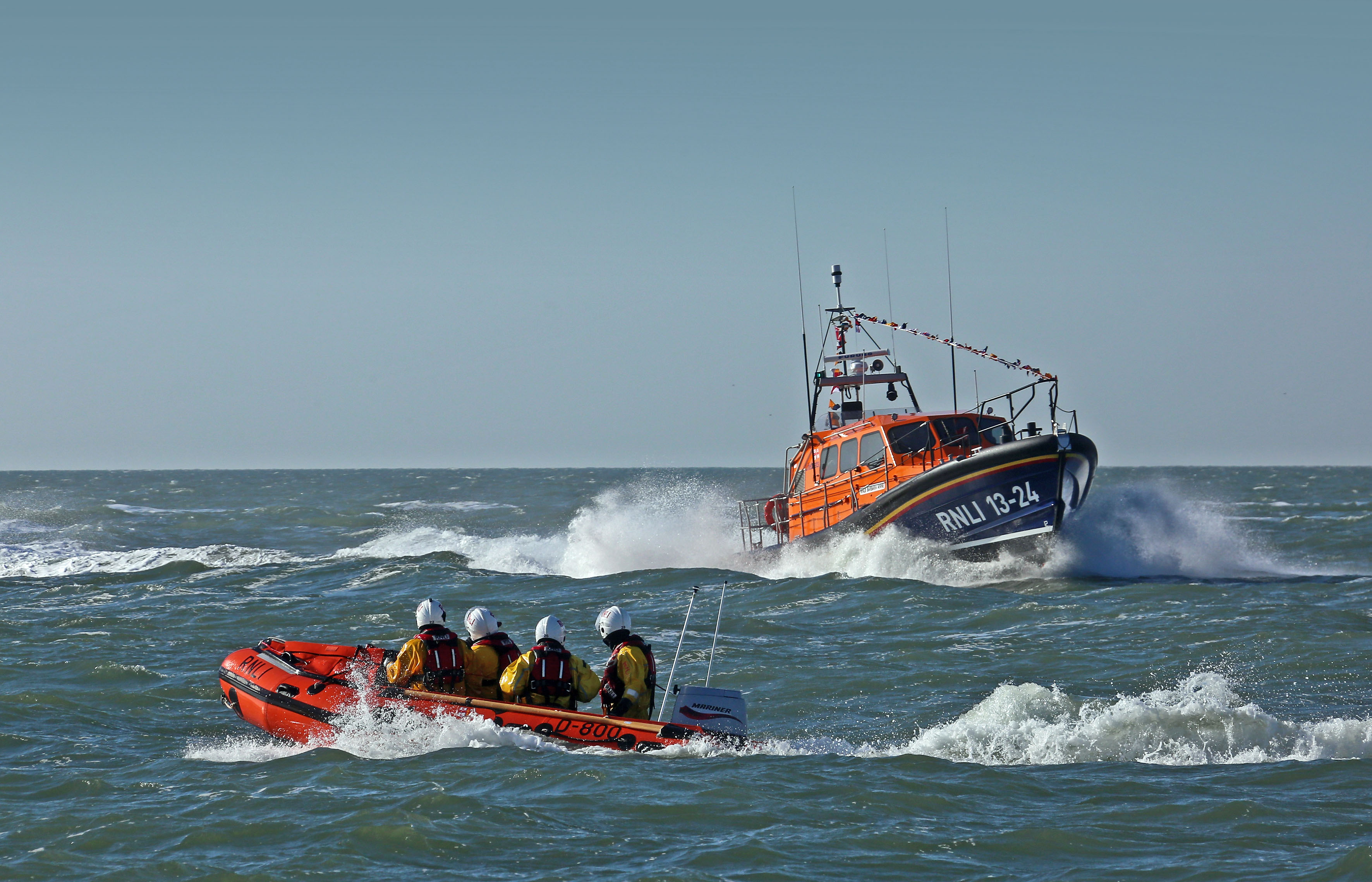 Lytham St Annes all-weather and inshore lifeboats at sea in sunny weather. 