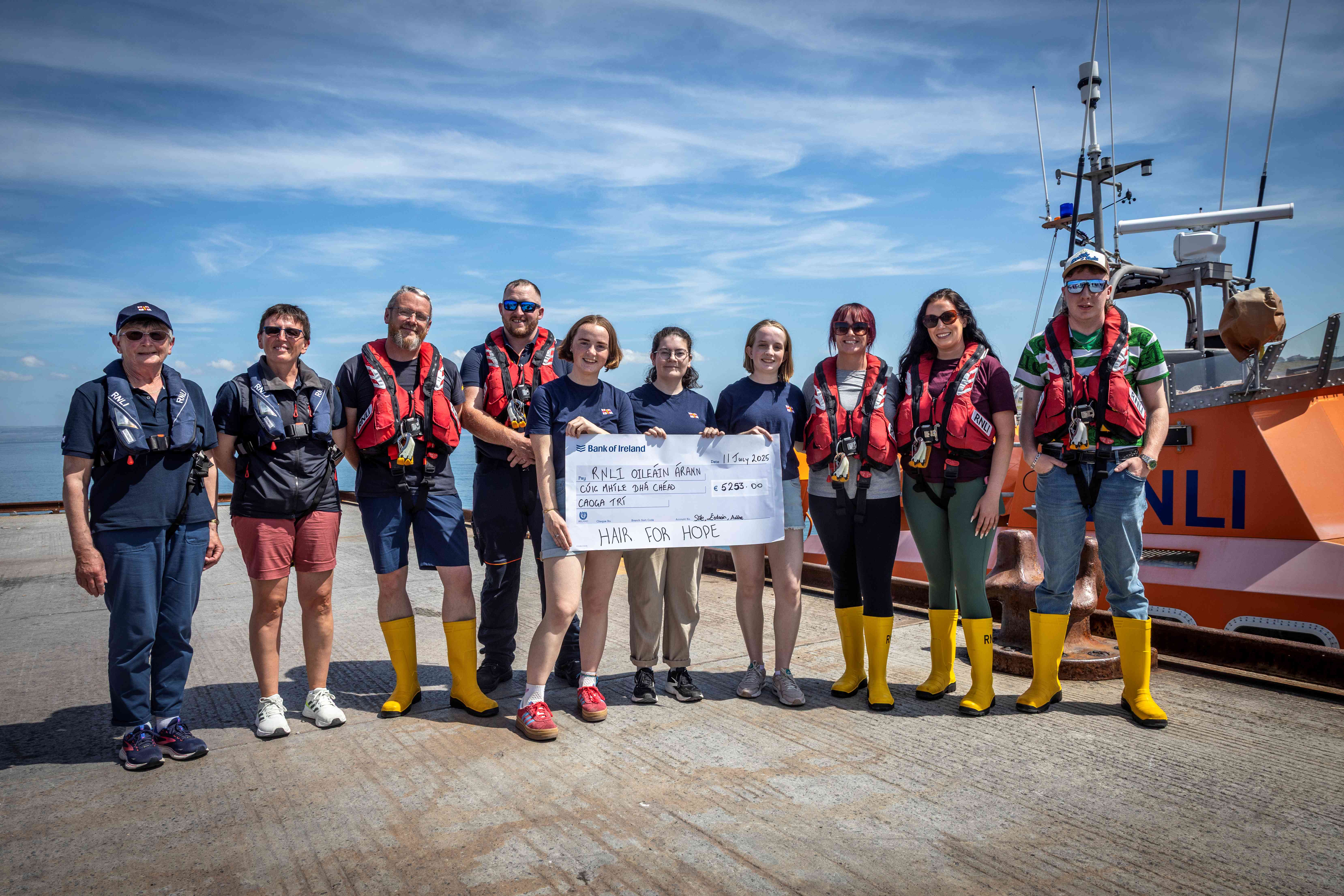 Aran Islands Crew and Fundraising being presented a cheque from Aoibhe, Sile and Éadaoin
