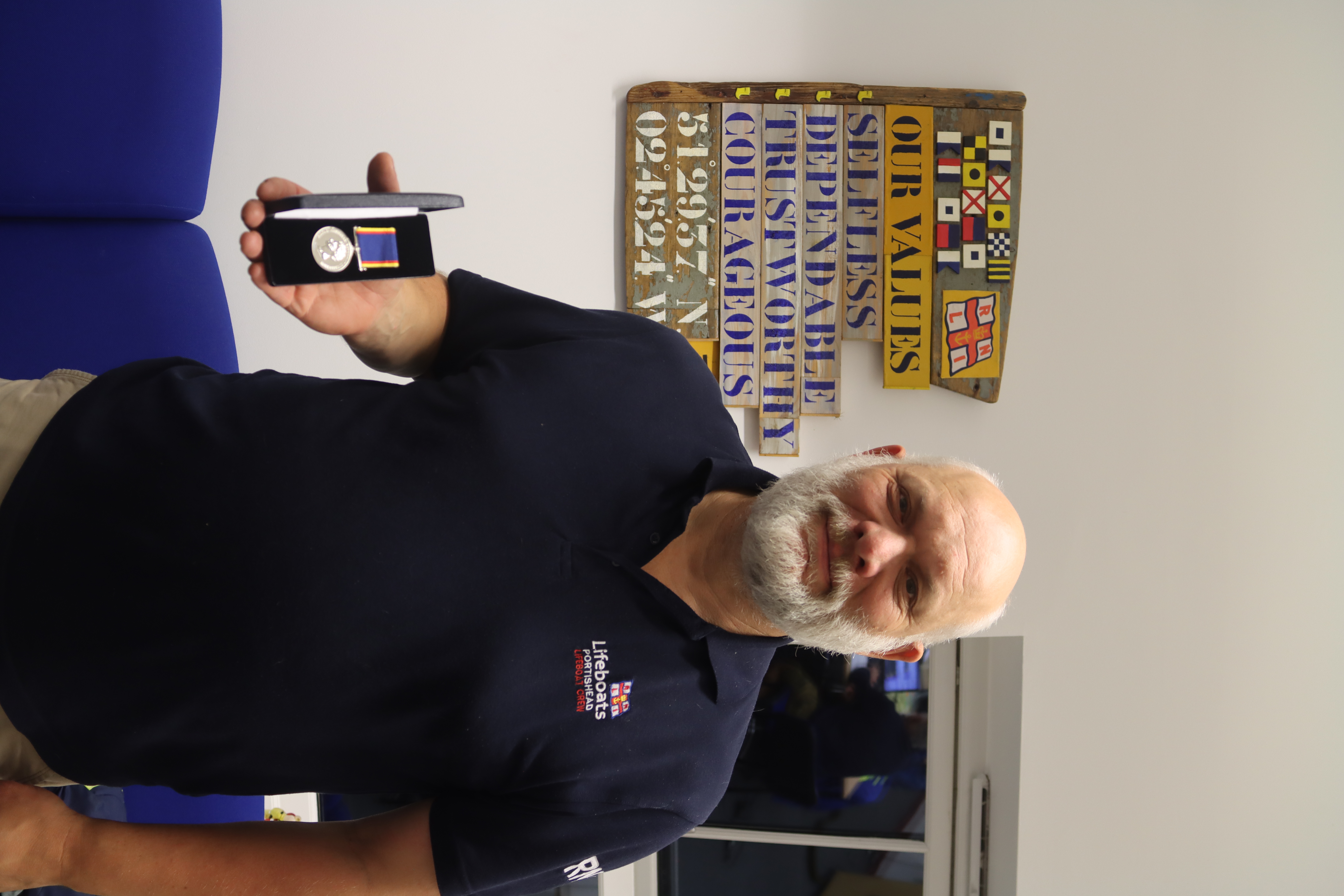 Neil receiving his 20 year medal for service to volunteering in October 2023
