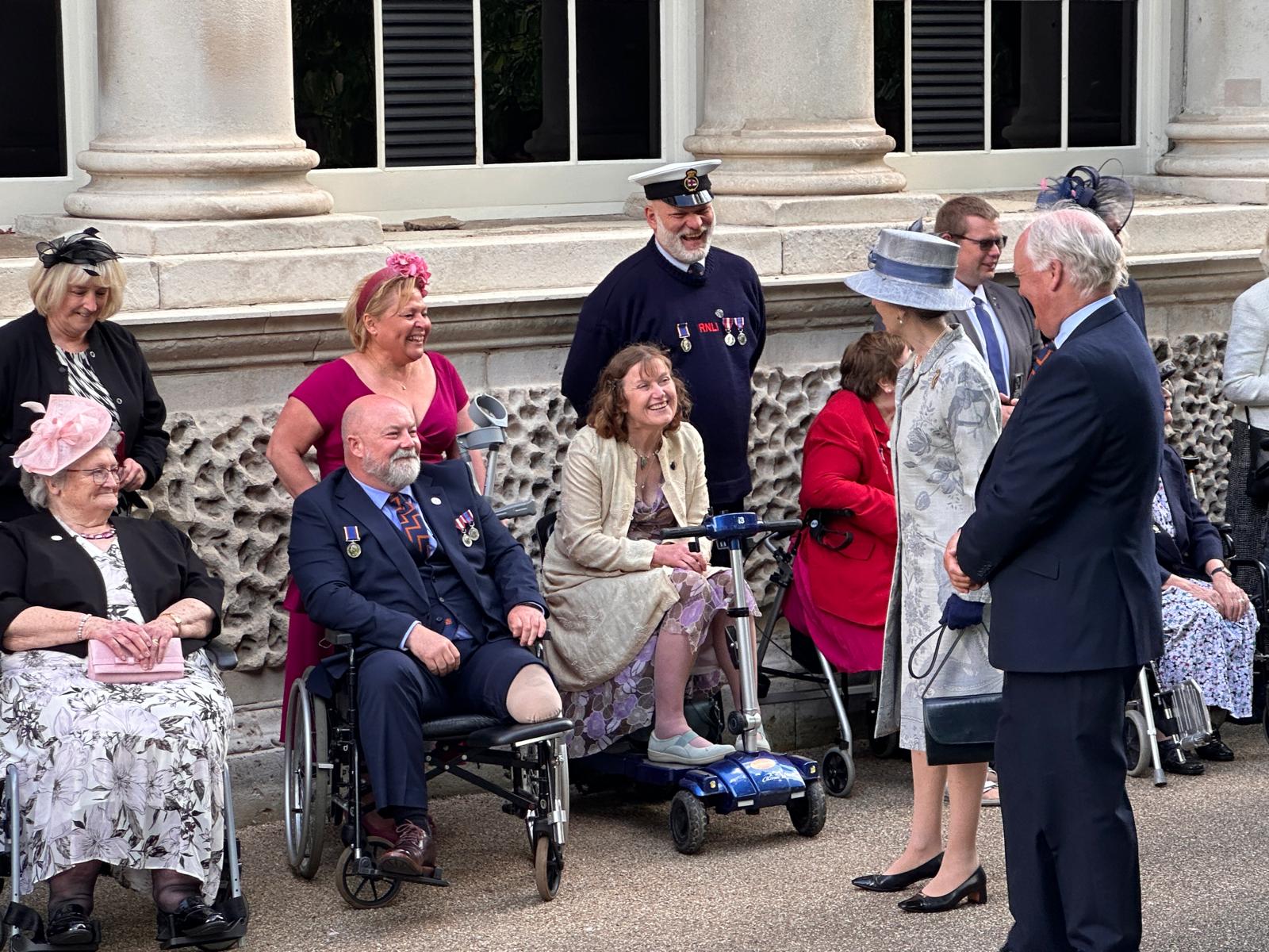 Neil (central) and his wife Debbie met HRH the Princess Royal at Buckingham Palace alongside Dave Slack who has recently retired from LOM and his wife Helen