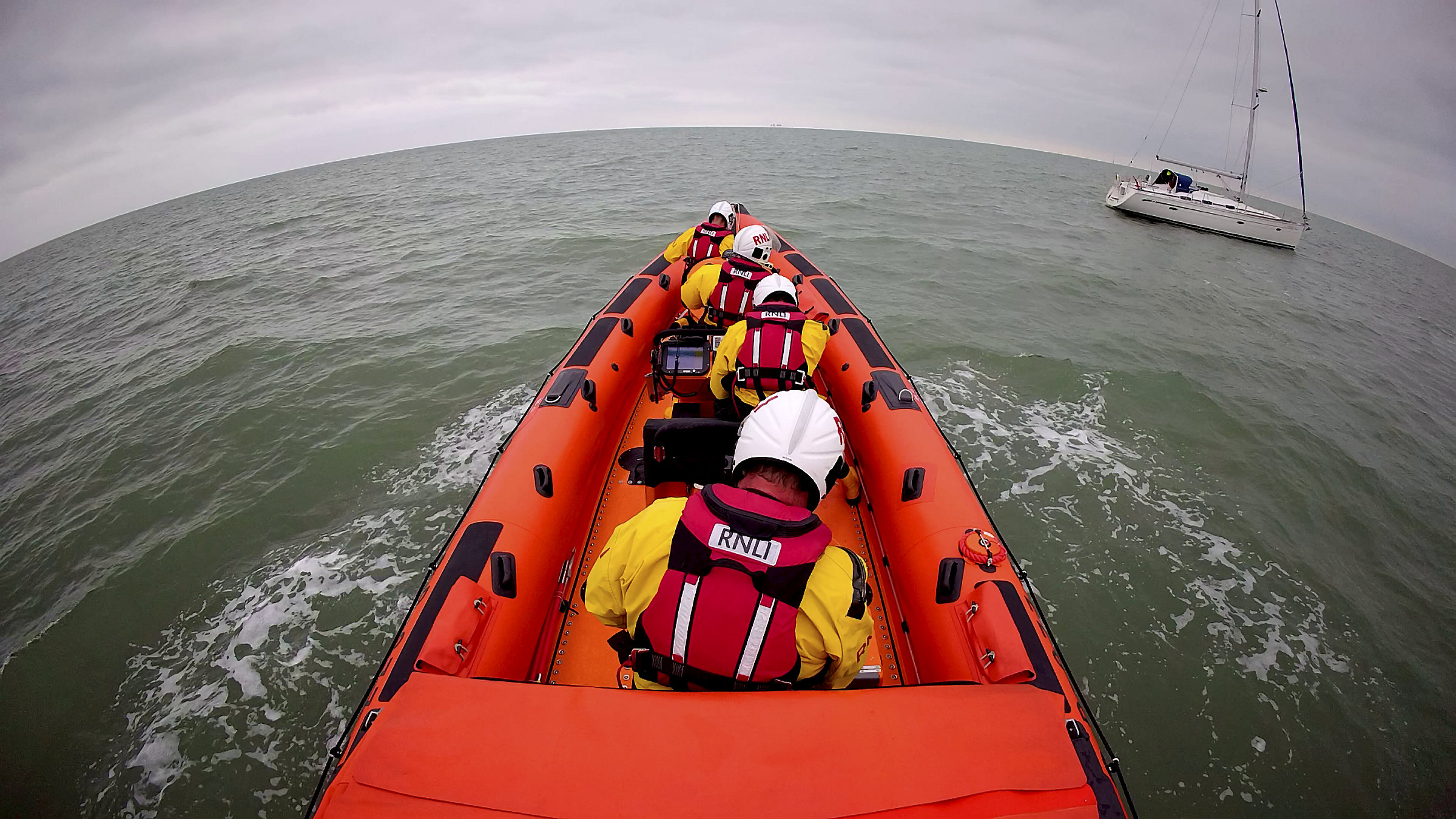 The Whitstable lifeboat approaches the yacht that went aground off Sheppey on Sunday morning.