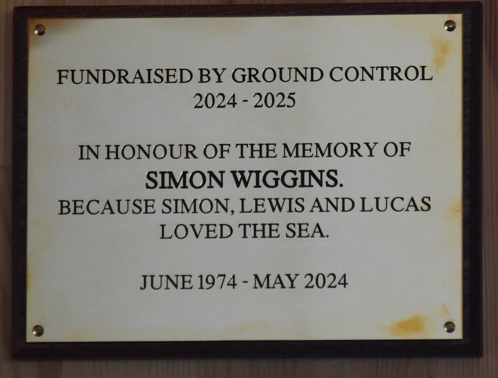 Plaque with Simons Wiggins name and dates with wording ' Because Simon, Lewis and Lucas loved the sea'