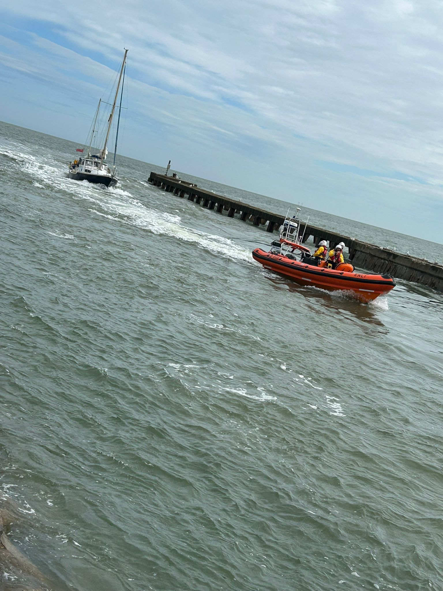 Southwold Atlantic 85 Annie Tranmer tows a yacht into harbour.