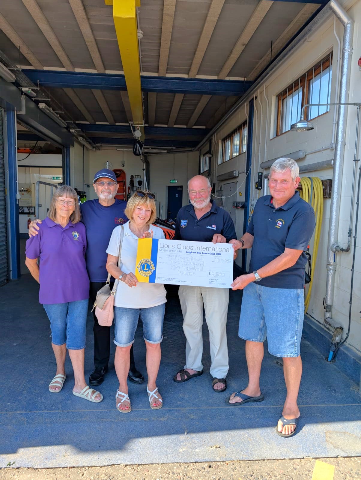Leigh Lions Club members at Southend lifeboat station presenting the funds raised