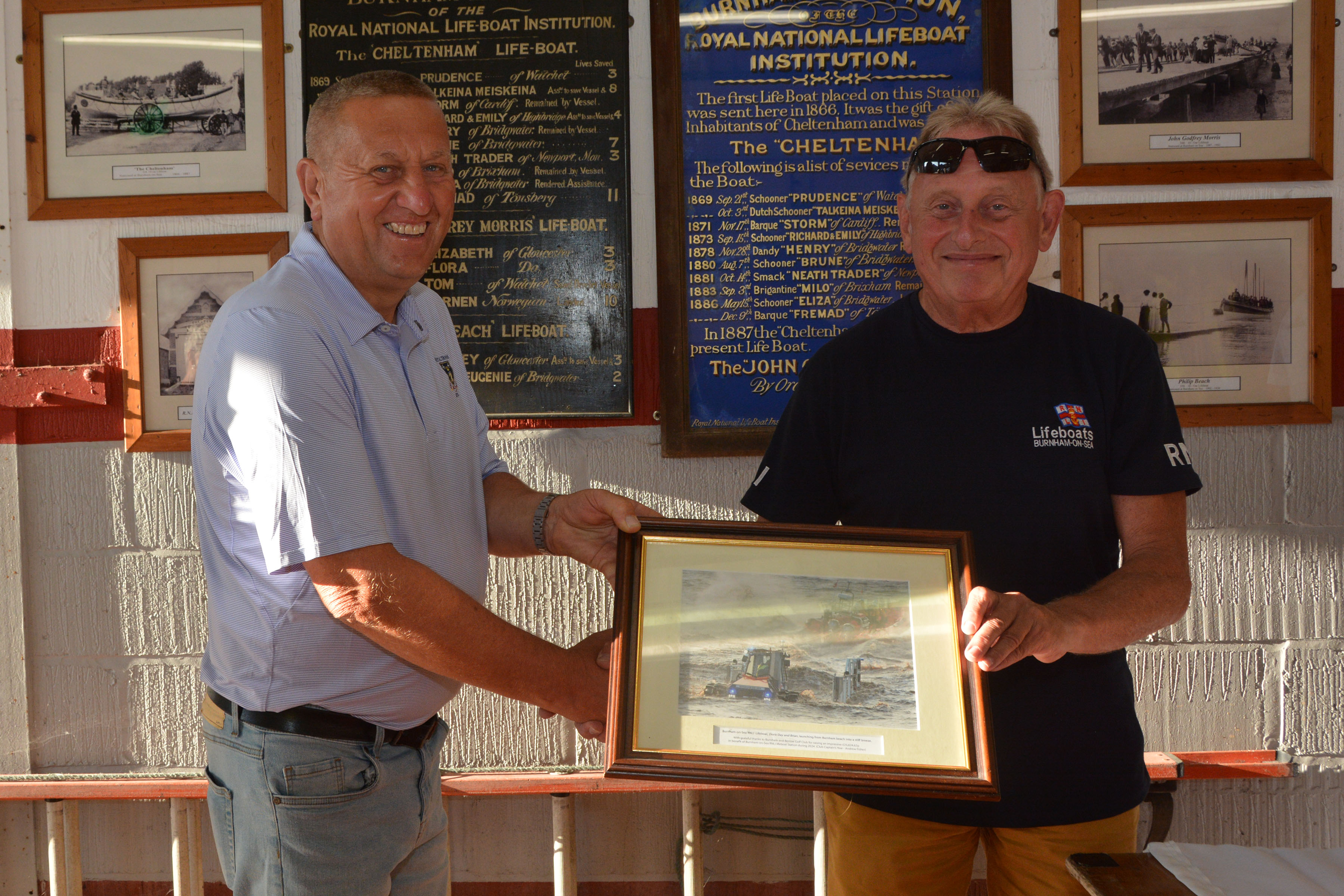 Cpast club captain and RNLI Chairman Nick Pople, with the presentation image