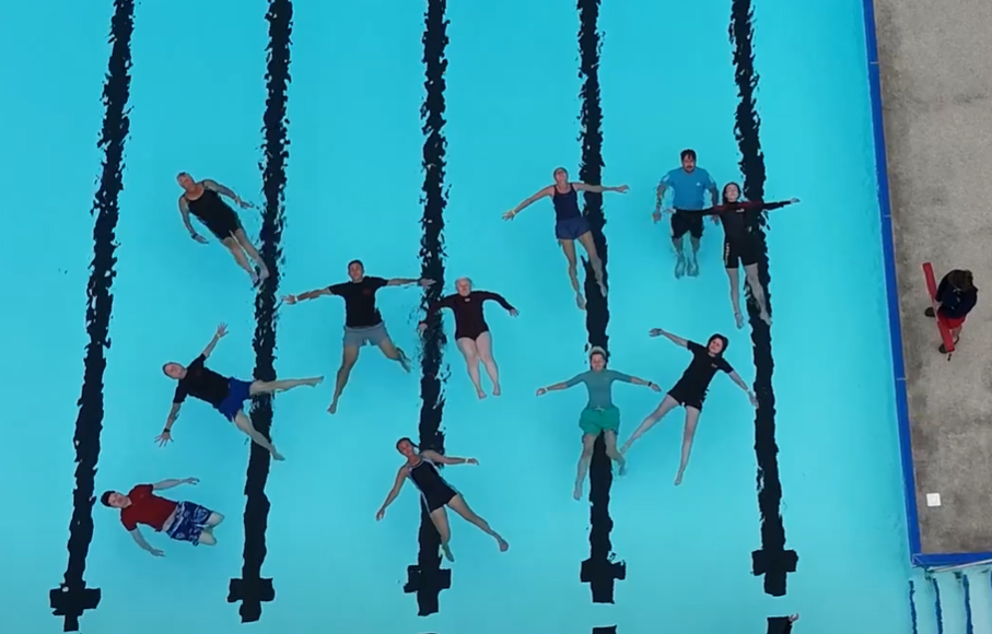drone shot from above of participants floating