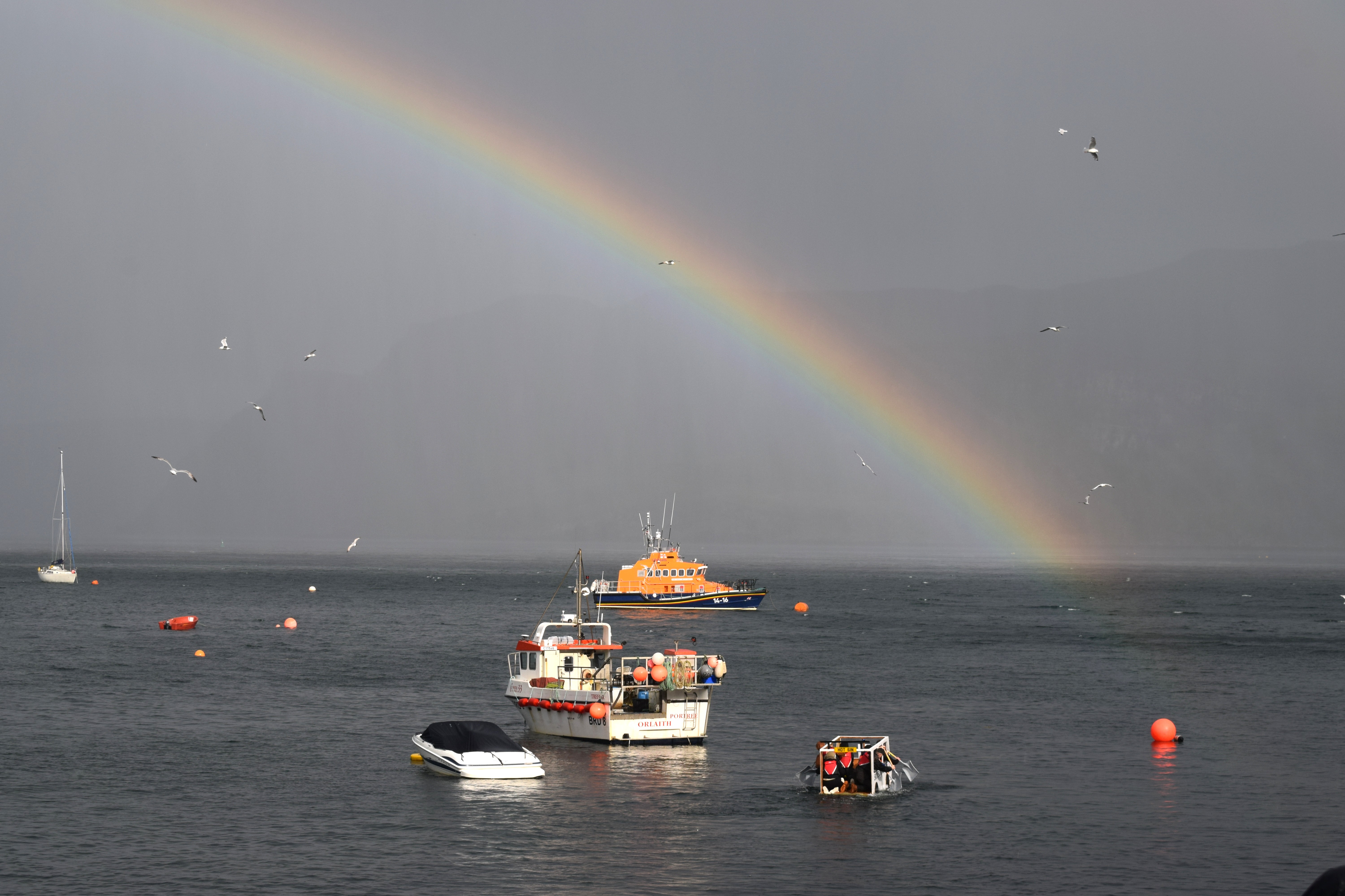 A rainbow over Portree lifeboat during one of the raft races.