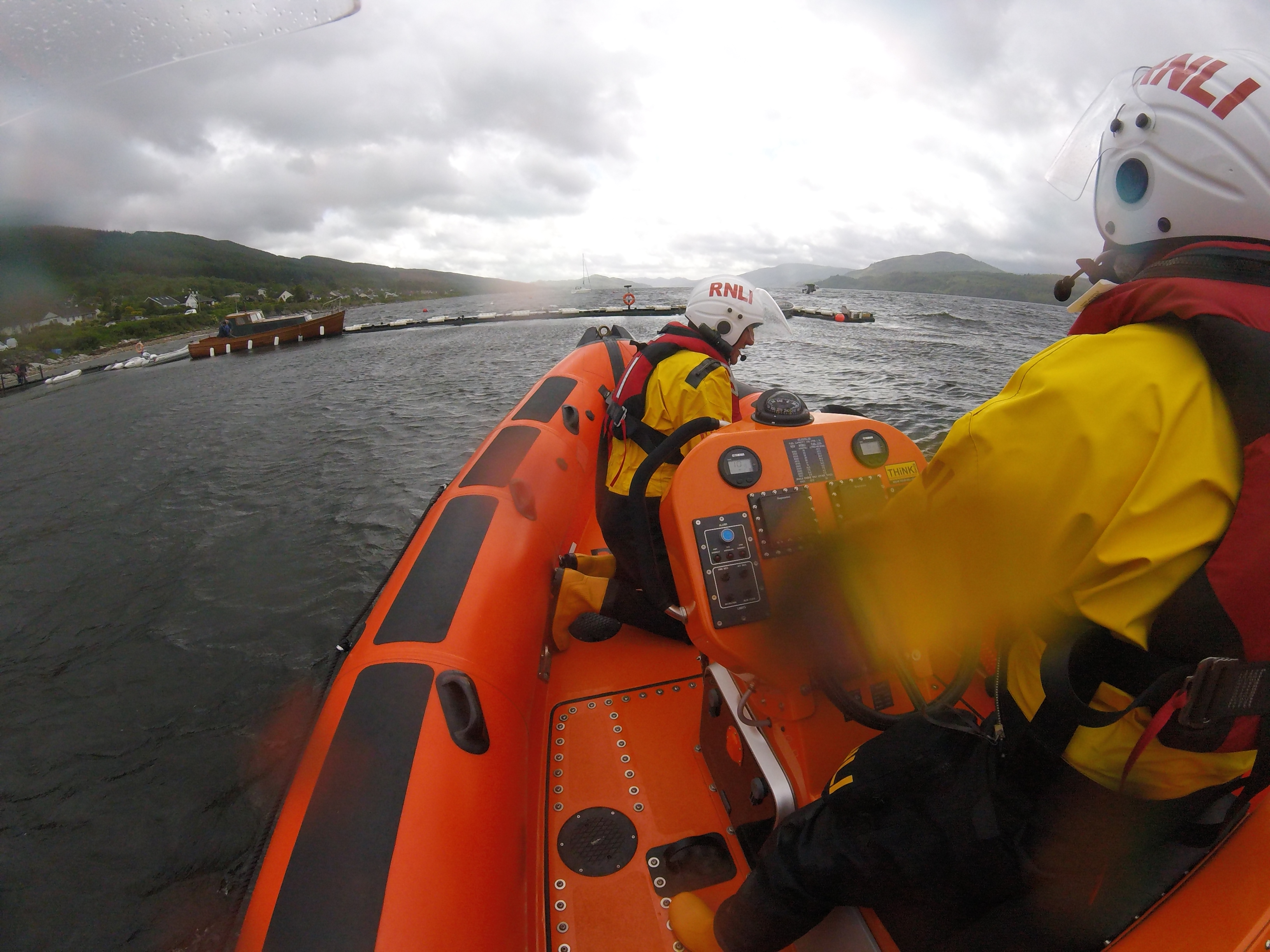 The lifeboat approached the safety of the jetty for casualty drop off