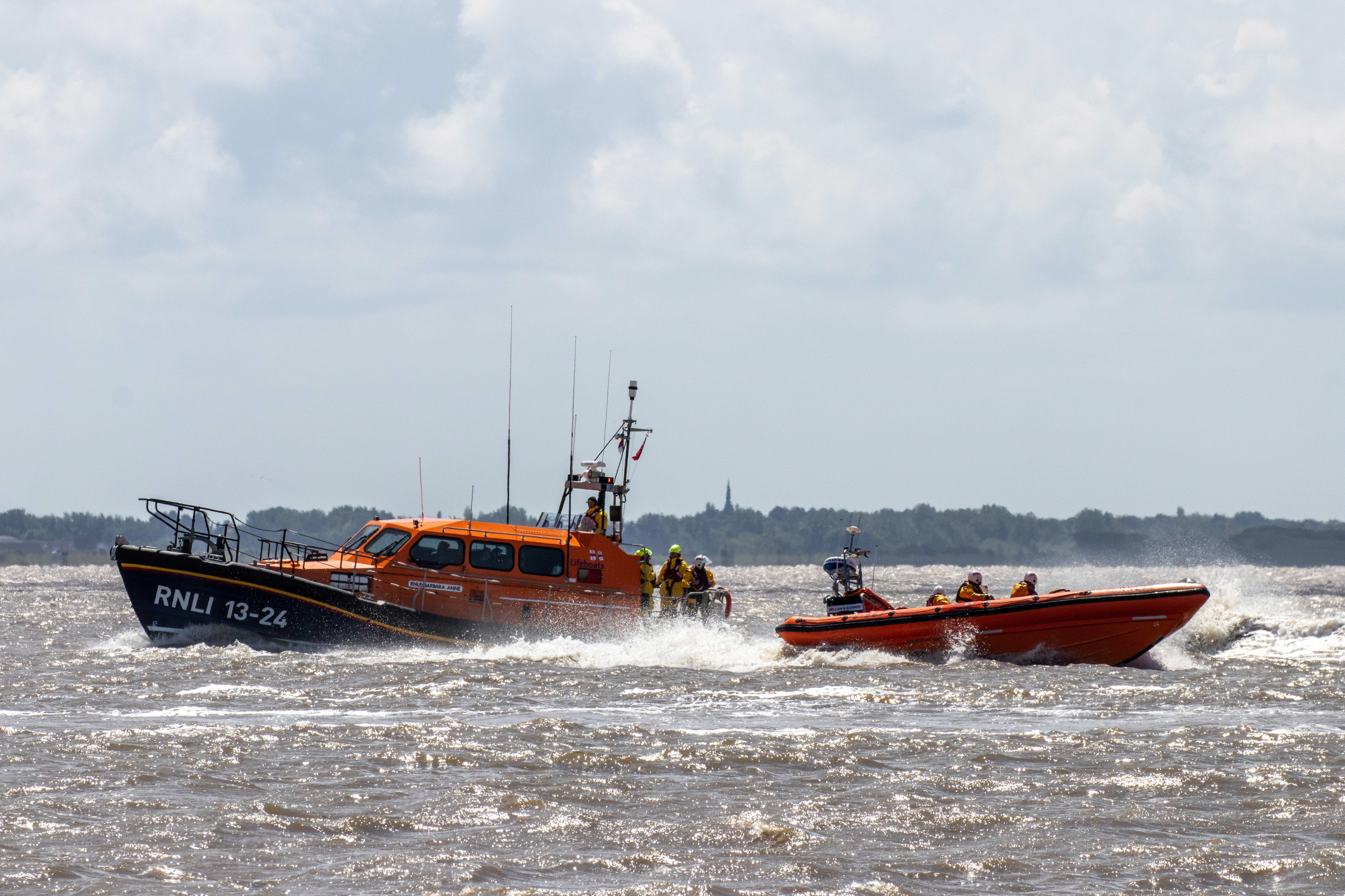 two lifeboats demonstrate on the water