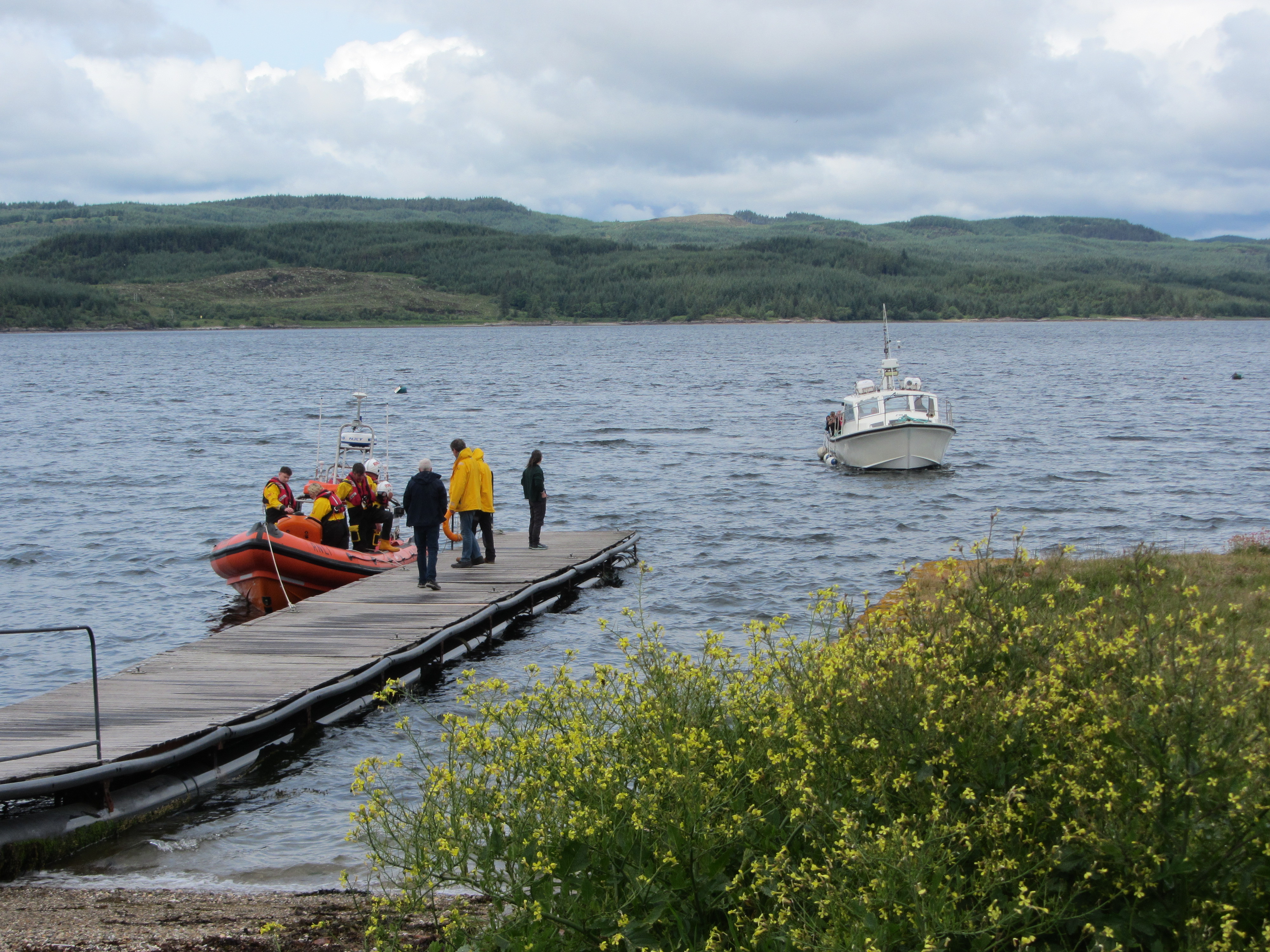 The lifeboat and Cowal Cruise tour boar share Otter Ferry jetty