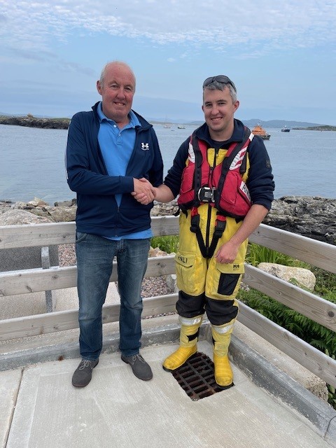 Arranmore RNLI new Coxswain Kieran O'Donnell pictured congratulated from his father Sean, also a former Coxswain.