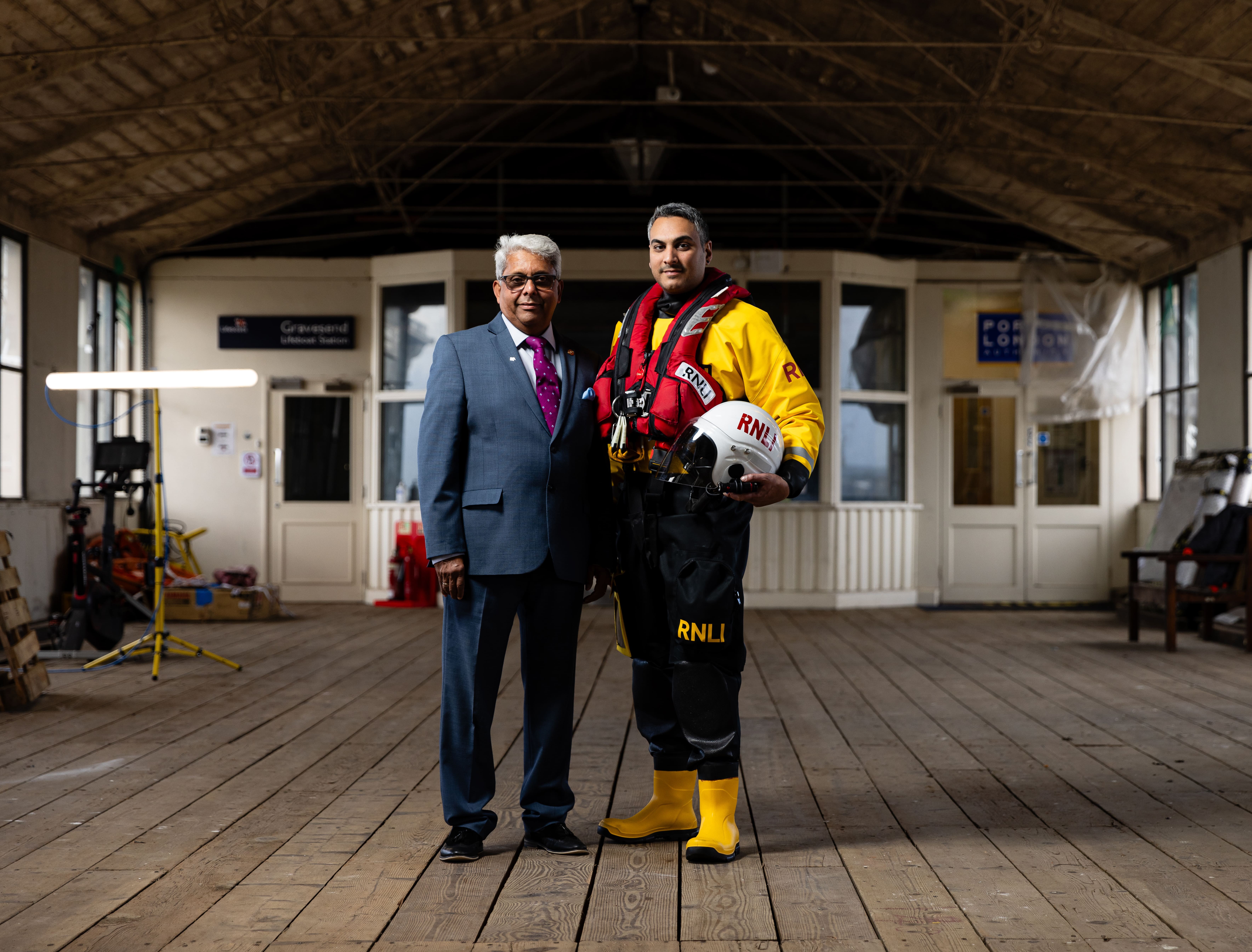 Nathan Vasudaven and his father Bhargawa standing in a Victorian pier
