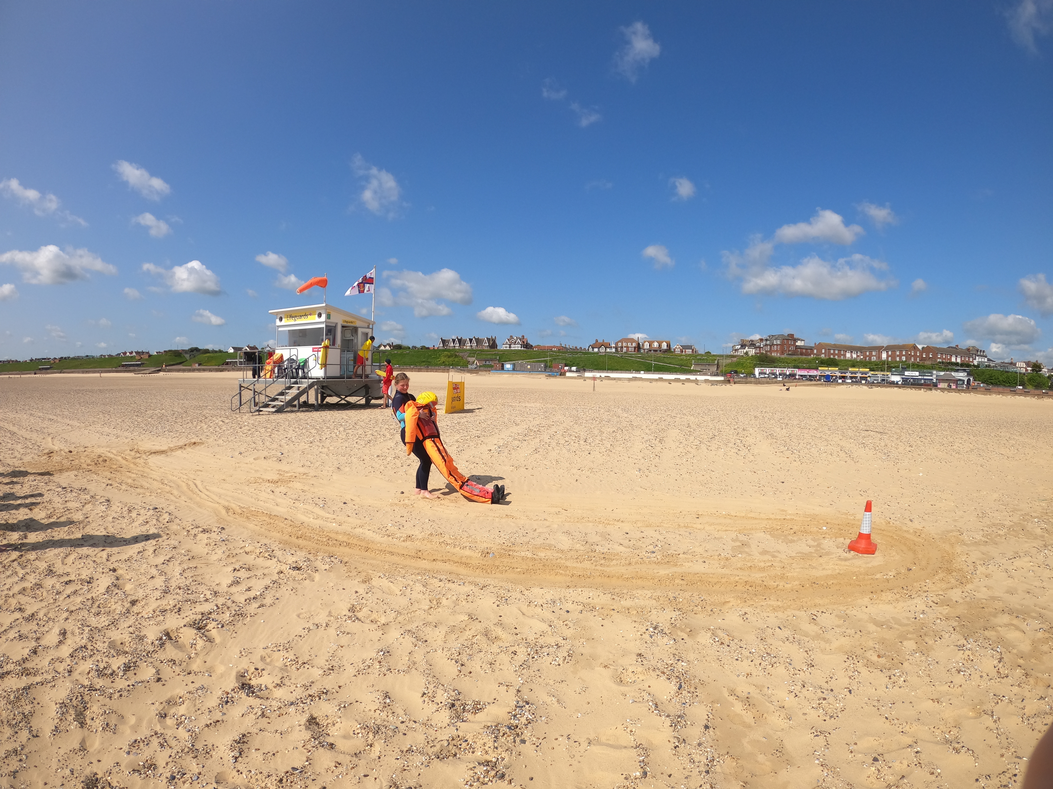 Lifeguards training on beach. Lifeguards and lifeguard unit on the beach sunny day
