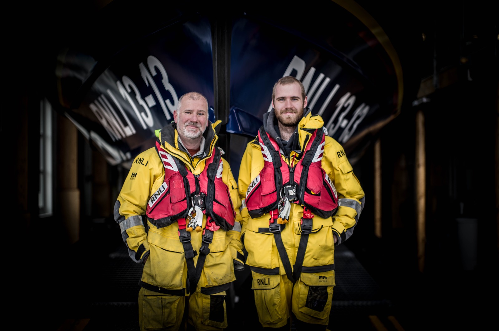 Father and son Steve and Felix Williams standing in front of Swanage lifeboat