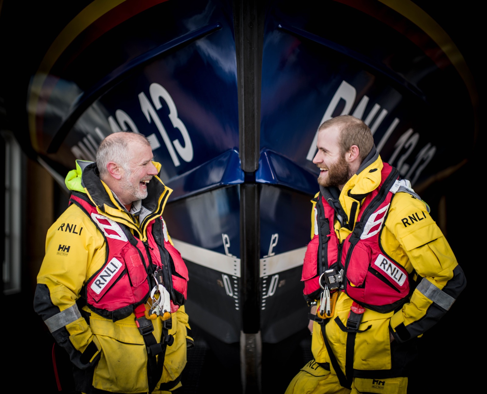 Father and son Steve and Felix Williams standing in front of Swanage lifeboat