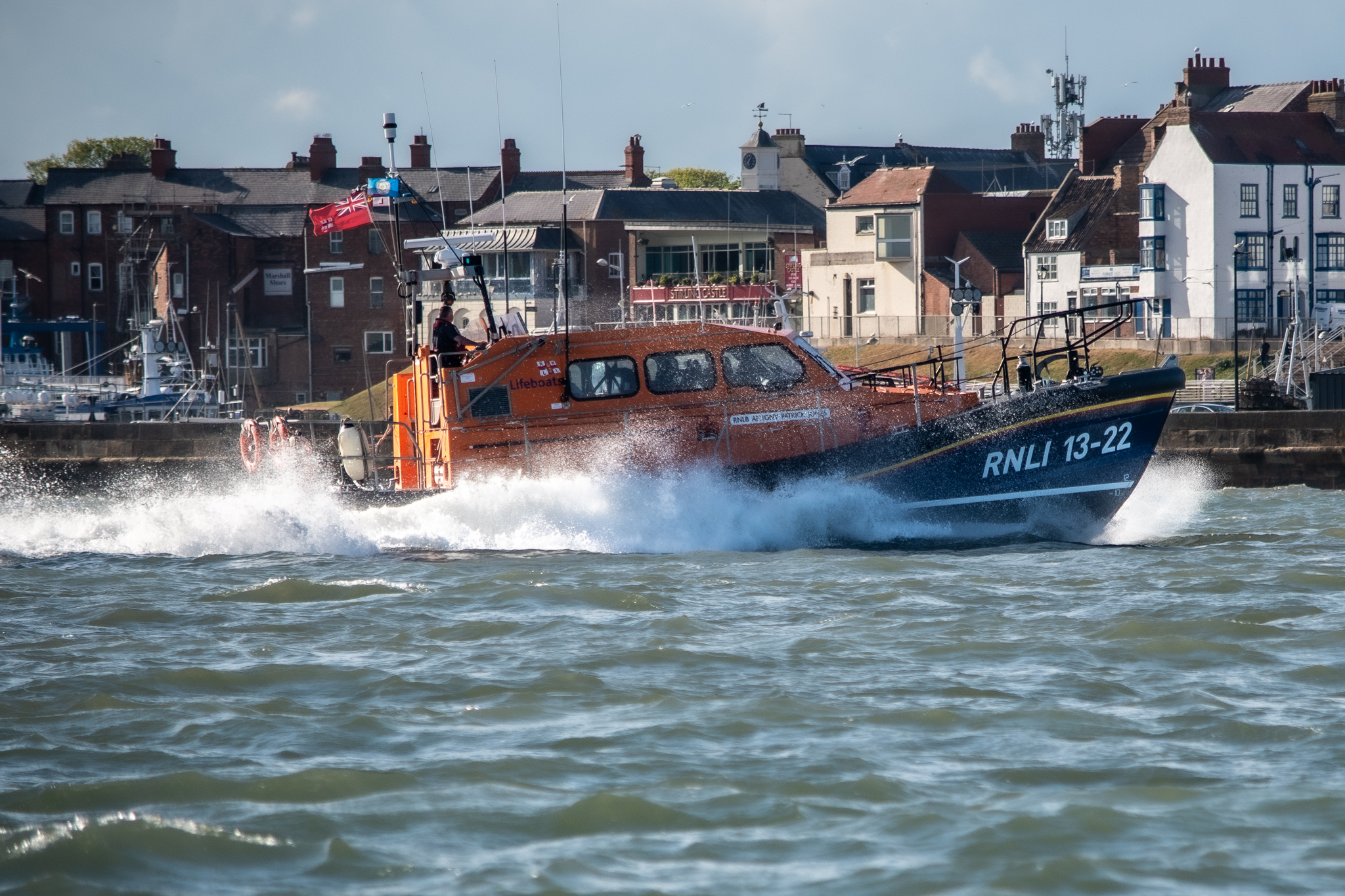 Bridlington RNLI Shannon class lifeboat passing Bridlington Harbour