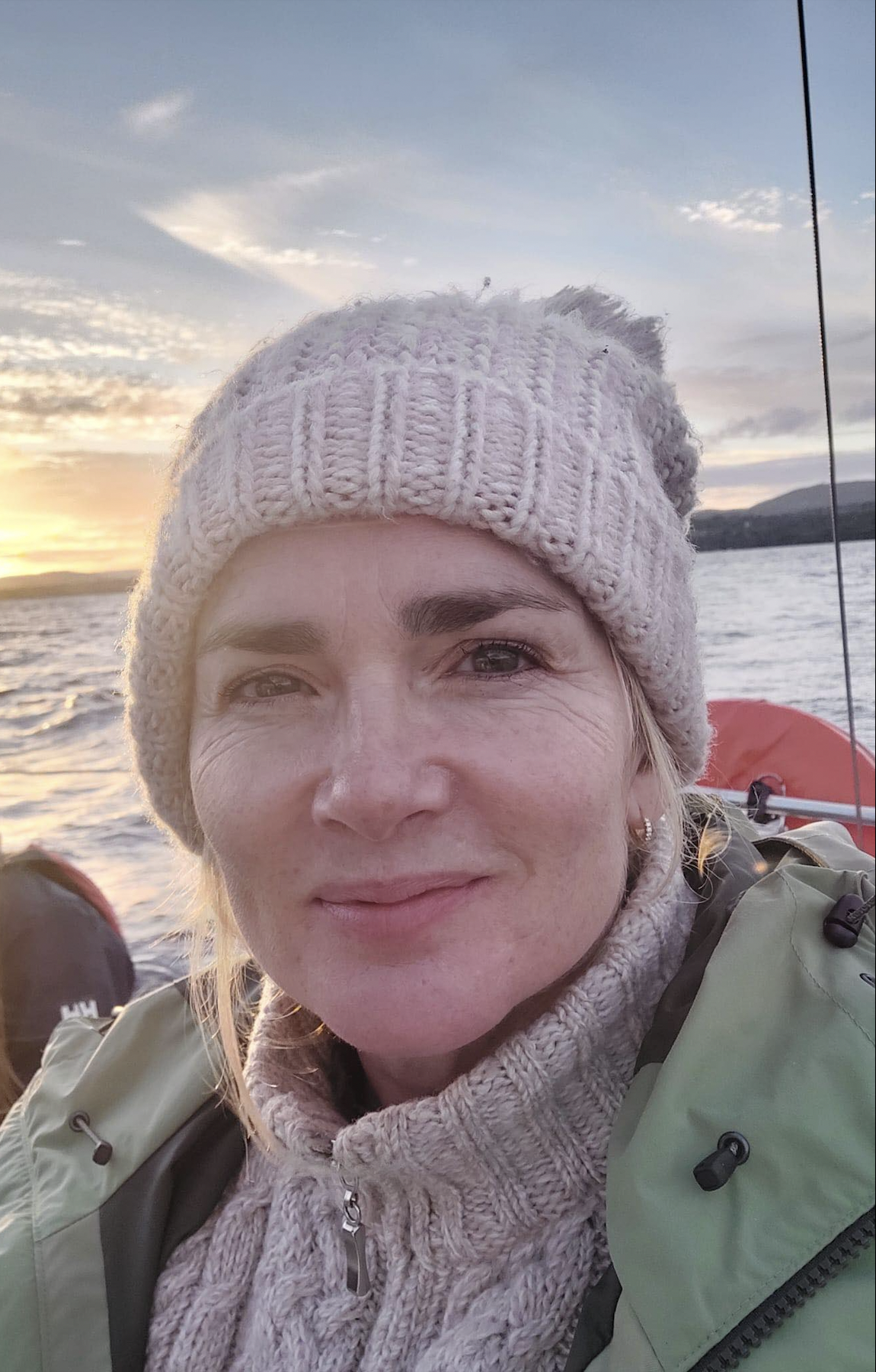 head shot of Mary in a boat, looking directly into camera