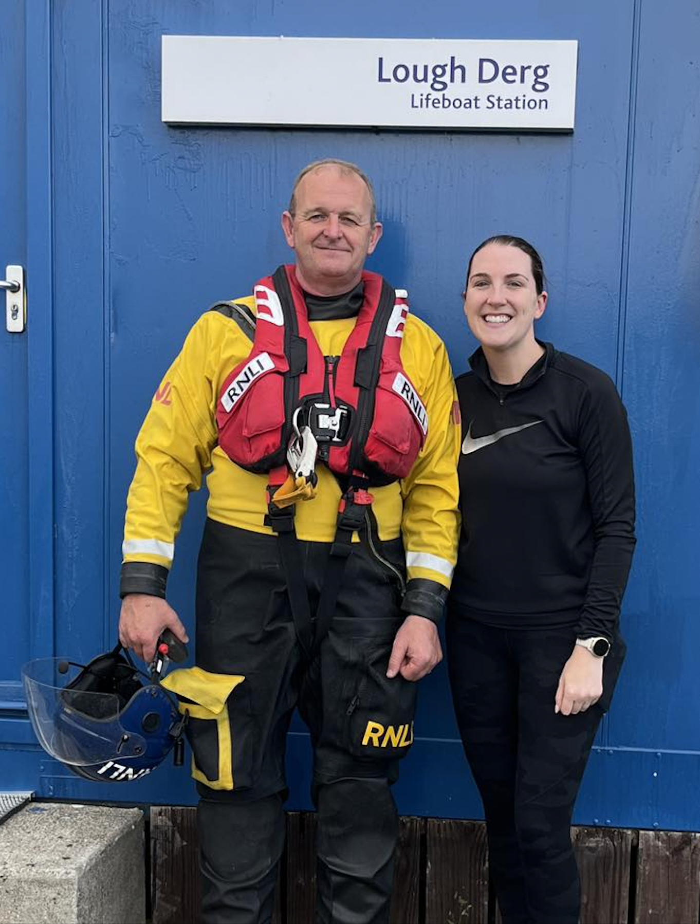 Seán, RNLI Assessor/Trainer and Ciara, RNLI crew standing outside the station following her assessment afloat