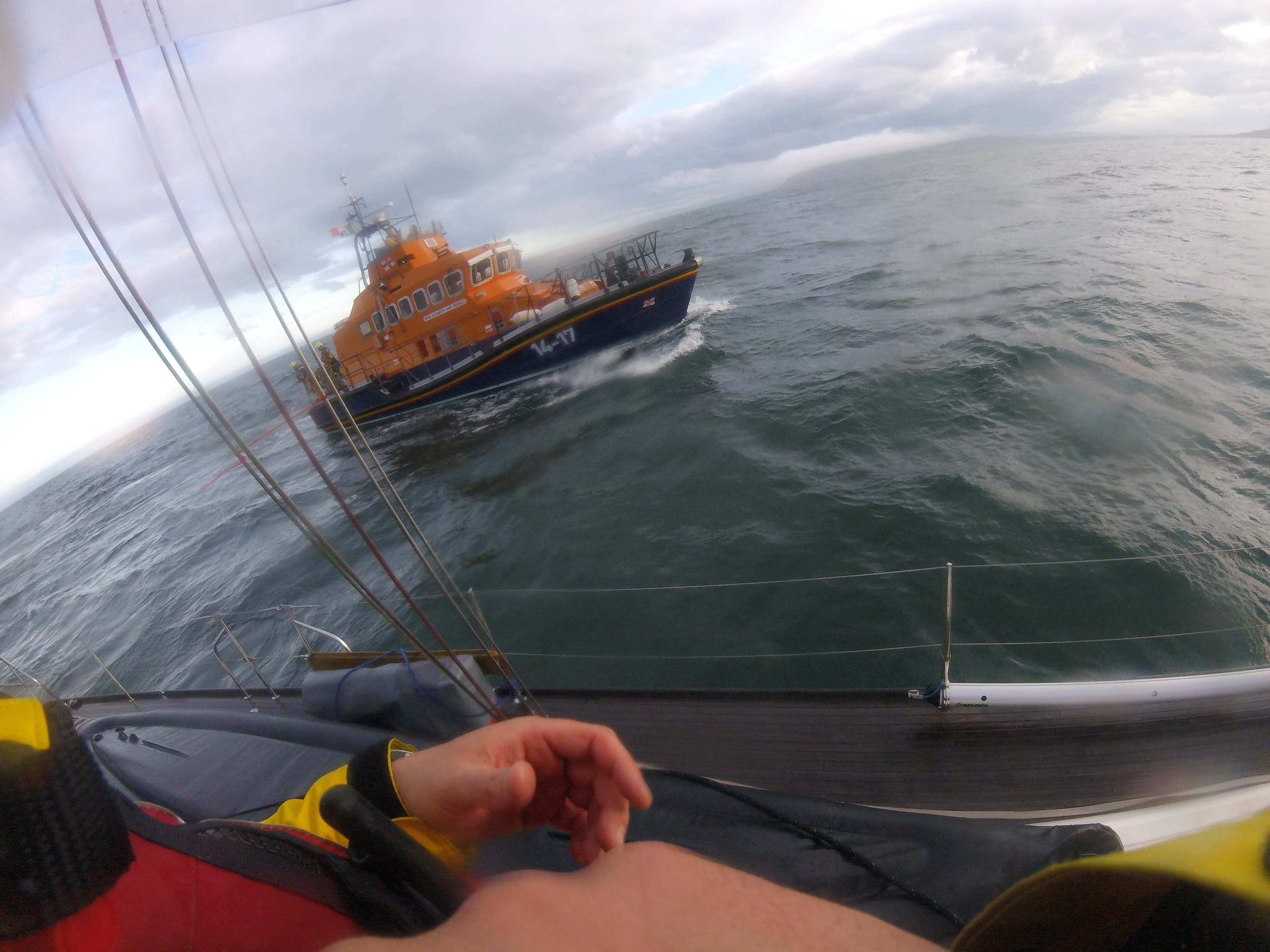 Howth Lifeboat alongside yacht in the Irish Sea