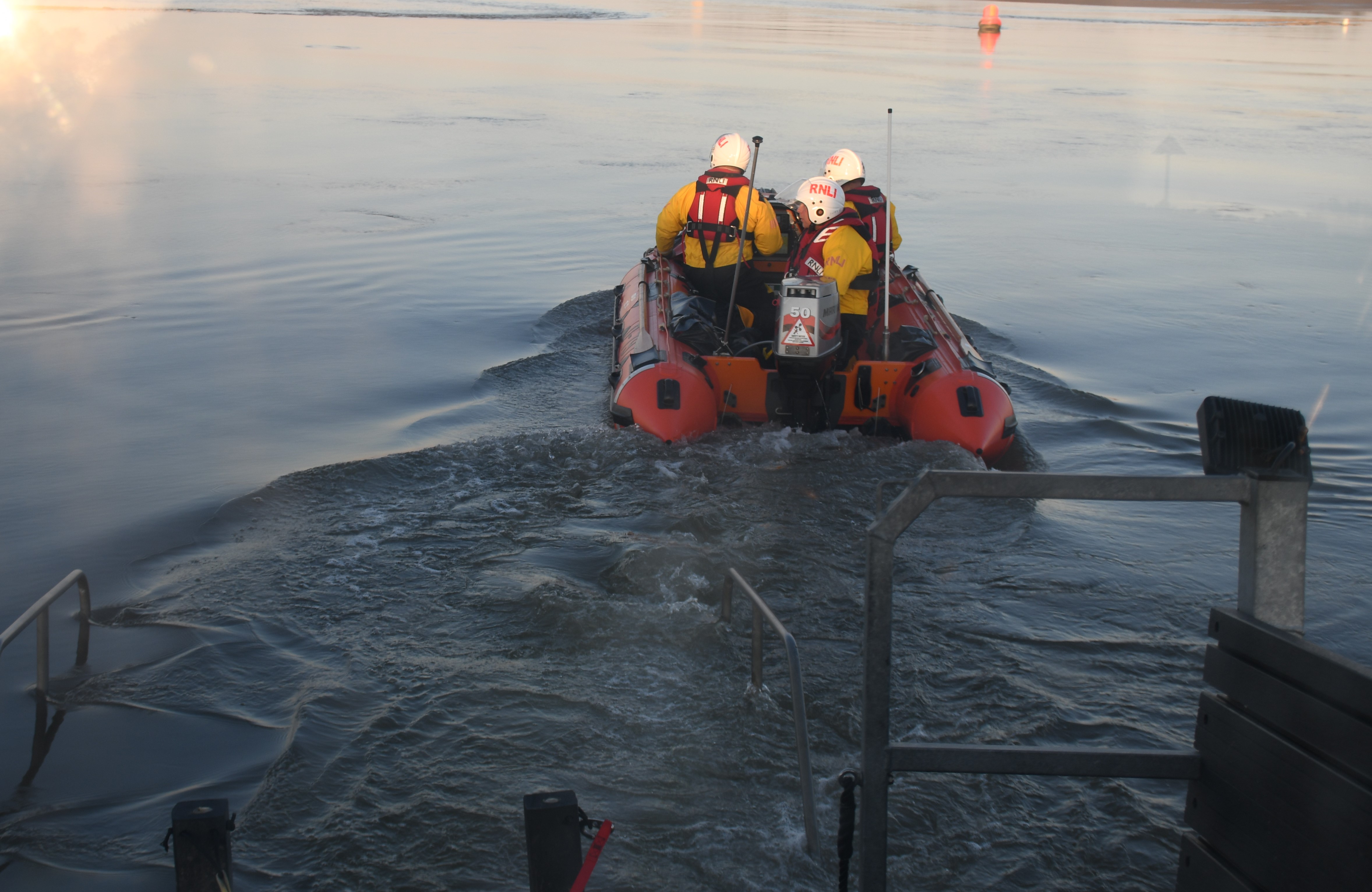 ells RNLI inshore lifeboat launching in missing person search with volunteer crew of three