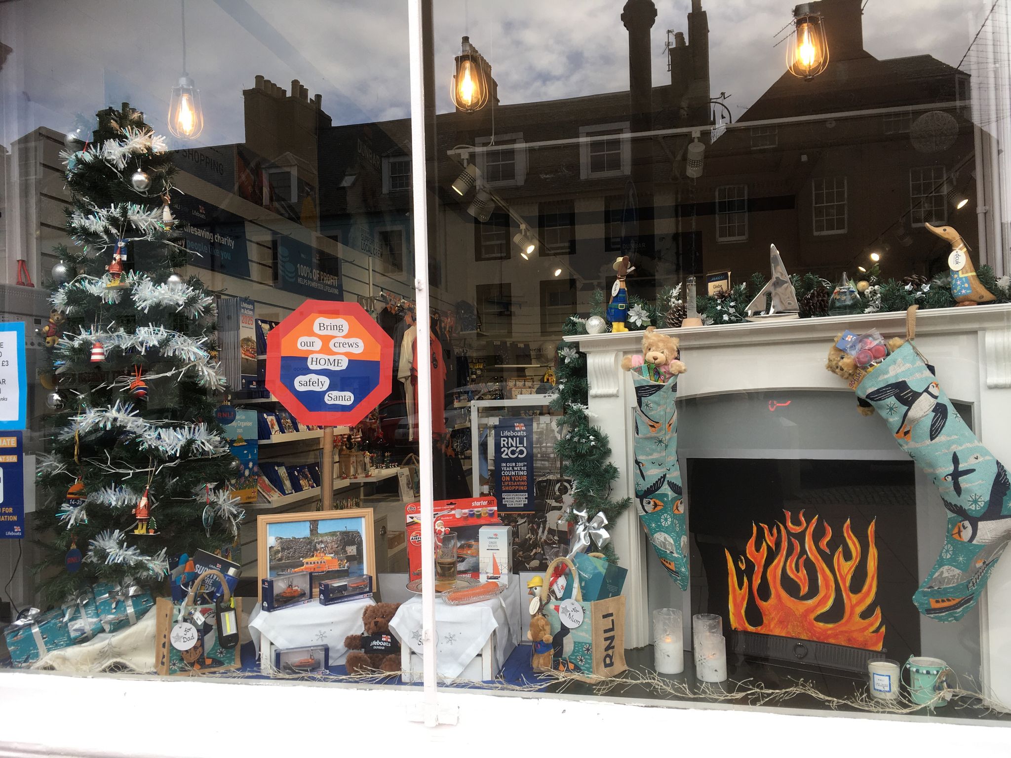 Window featuring a fireplace and tree.