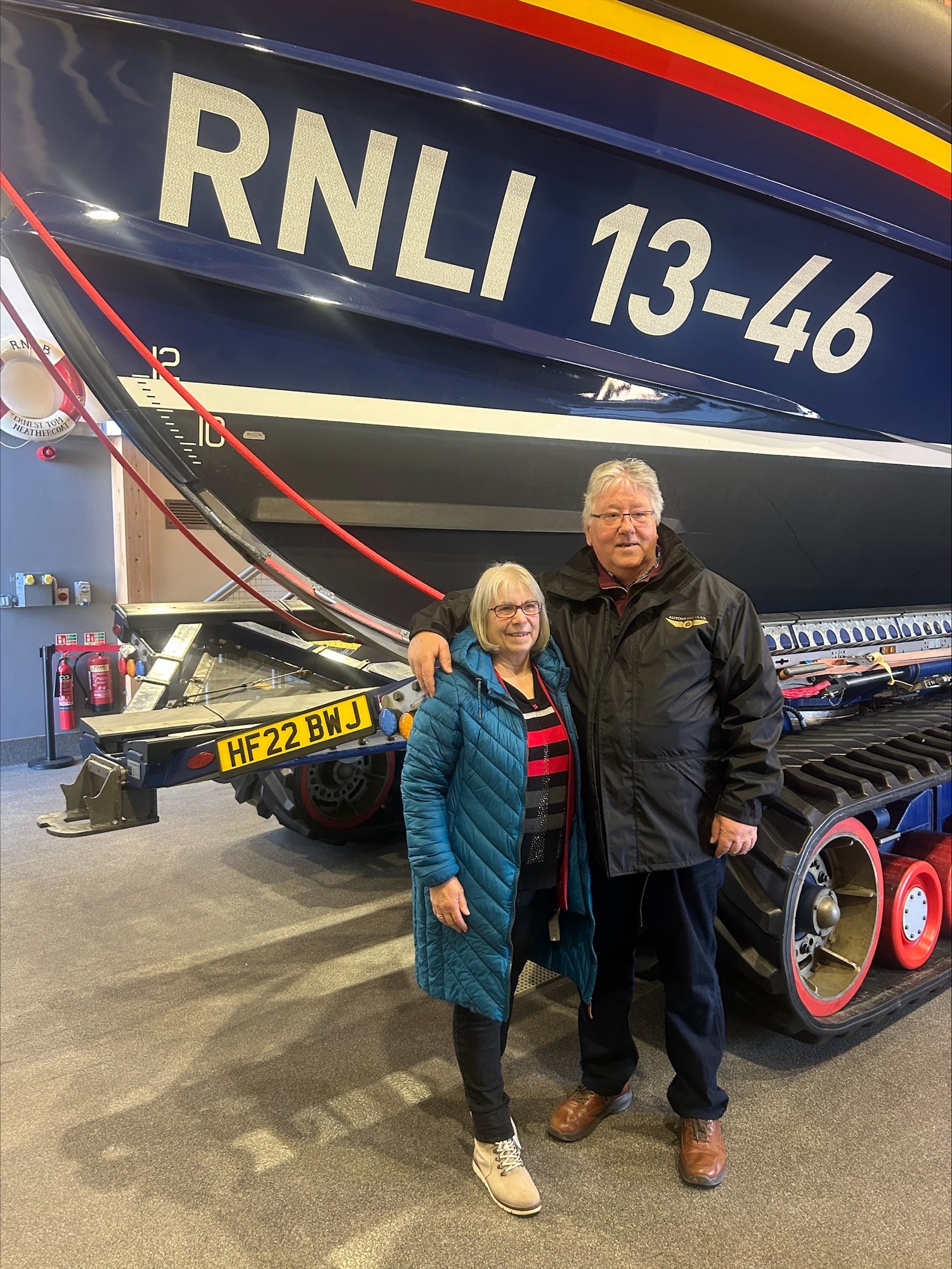 Wells RNLI Shannon class lifeboat 'Duke of Edinburgh' with Rob Arnold and his wife in front posing for photogragh