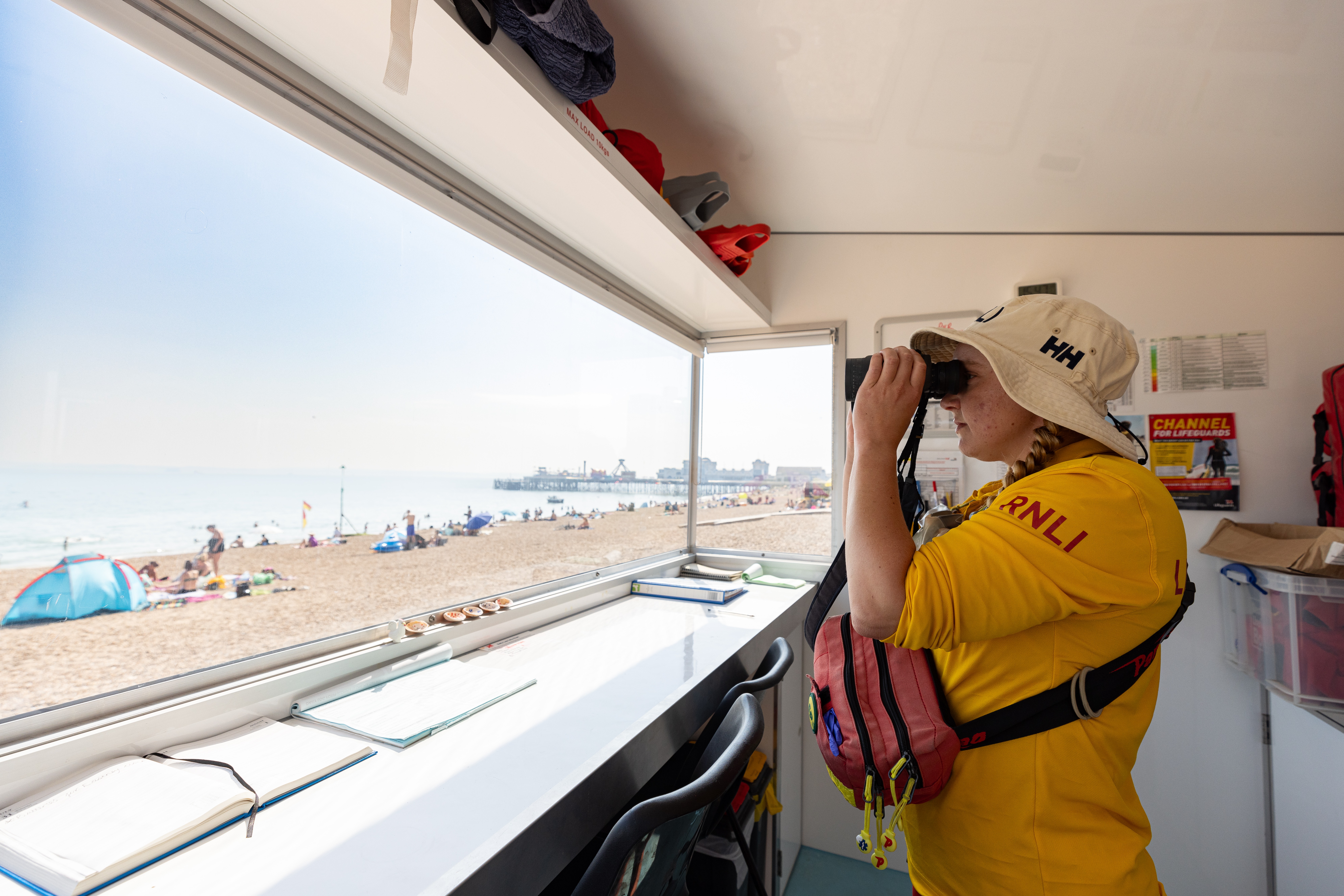 Lifeguard in a lifeguard unit looking over a beach