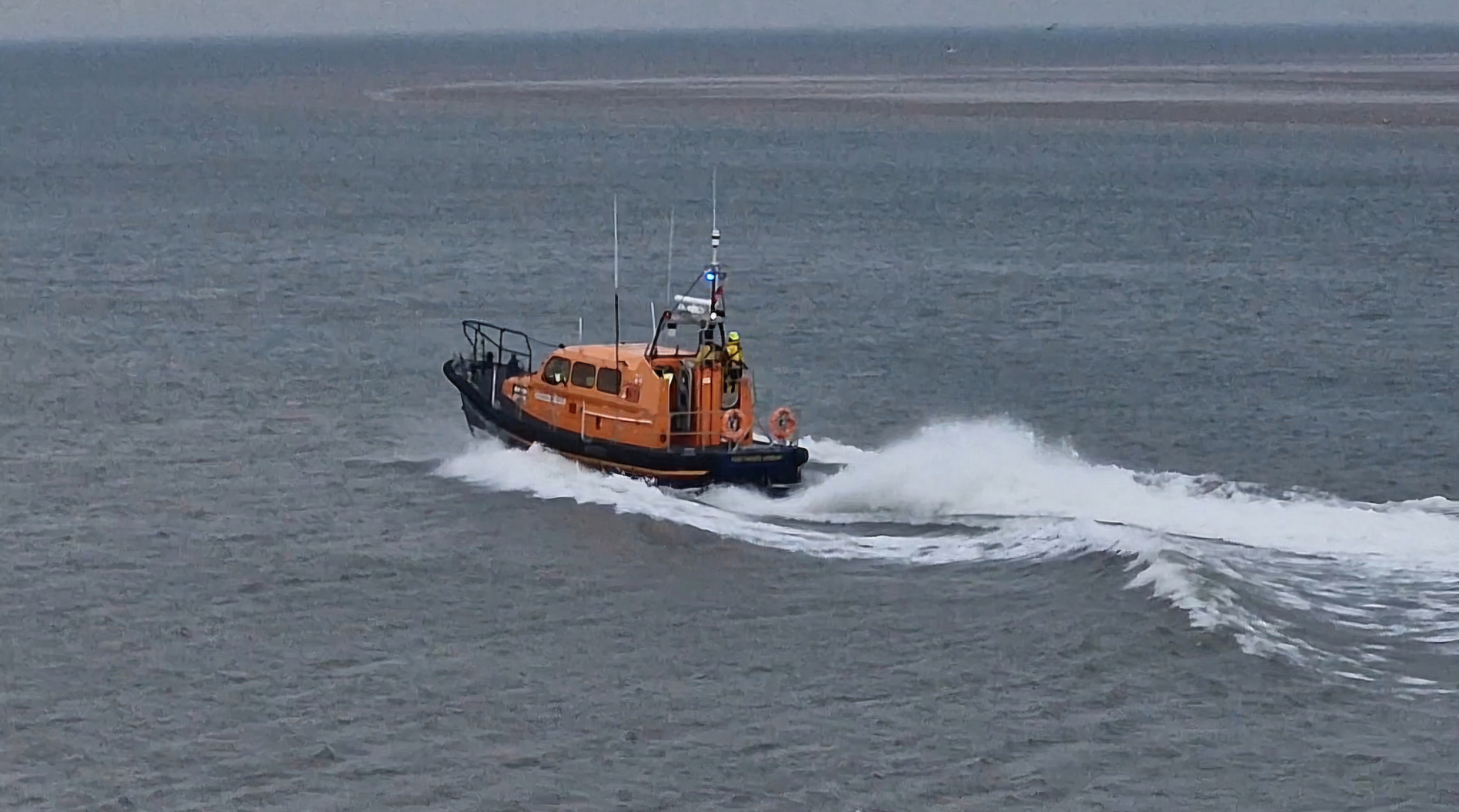 Shannon class lifeboat Kenneth James Pierpoint under way with wake astern