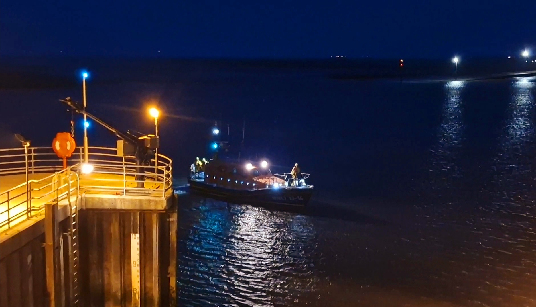 Shannon class lifeboat Kenneth James Pierpoint approaching the lifeboat station's mooring pen